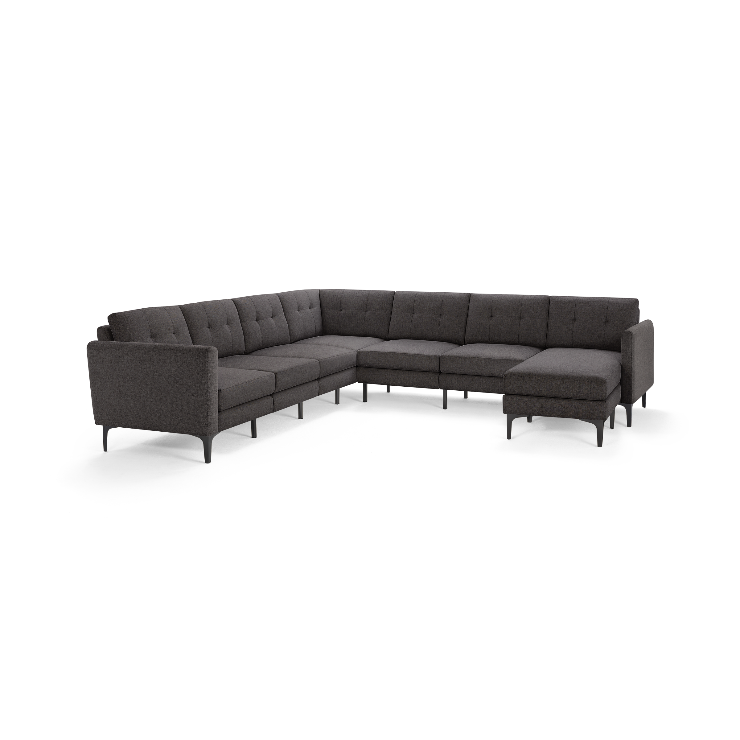 Dark gray fabric L-shaped sectional sofa with tufted back cushions and slim metal legs, featuring a chaise lounge on the right side.