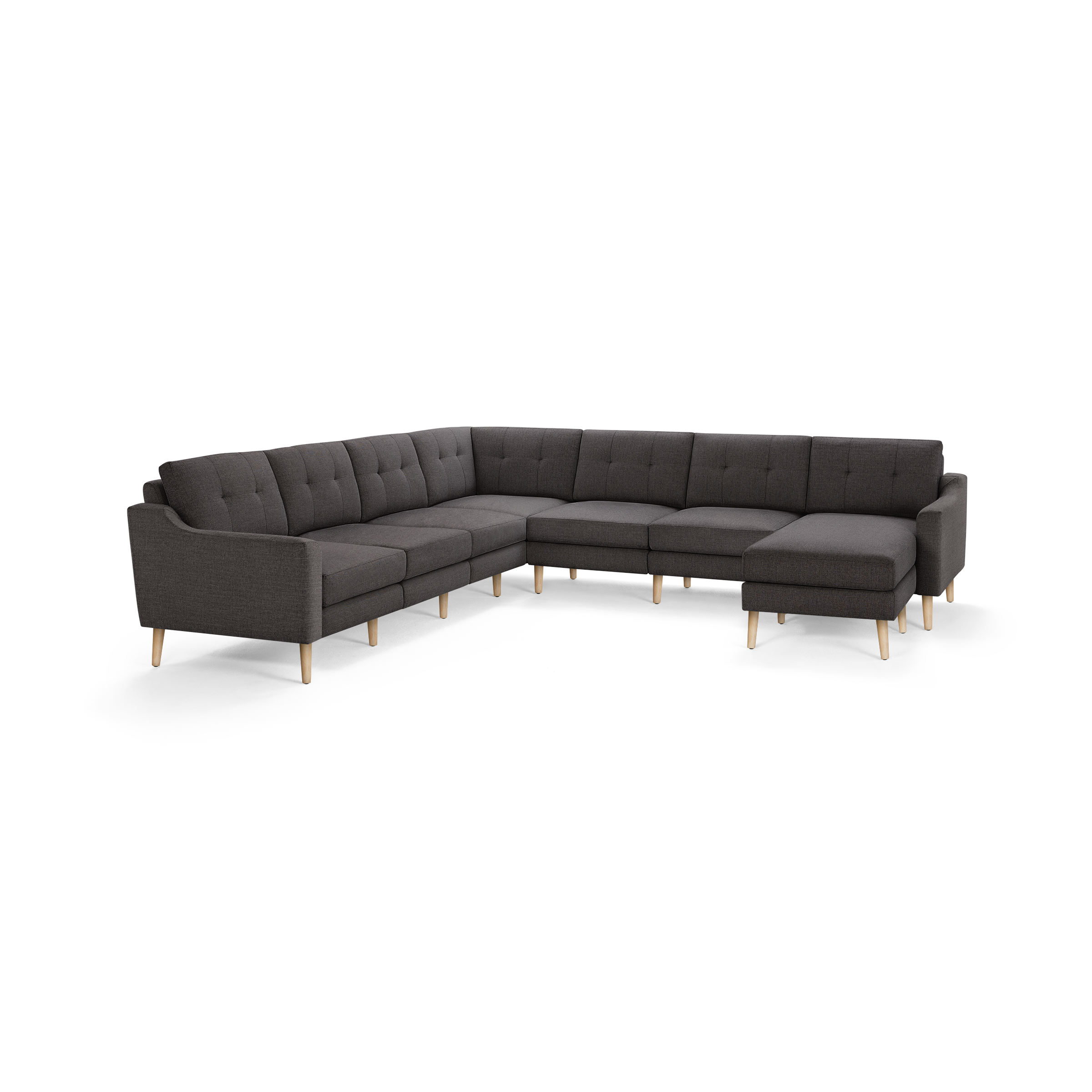 Dark gray L-shaped sectional sofa with button-tufted back cushions and light wooden legs.