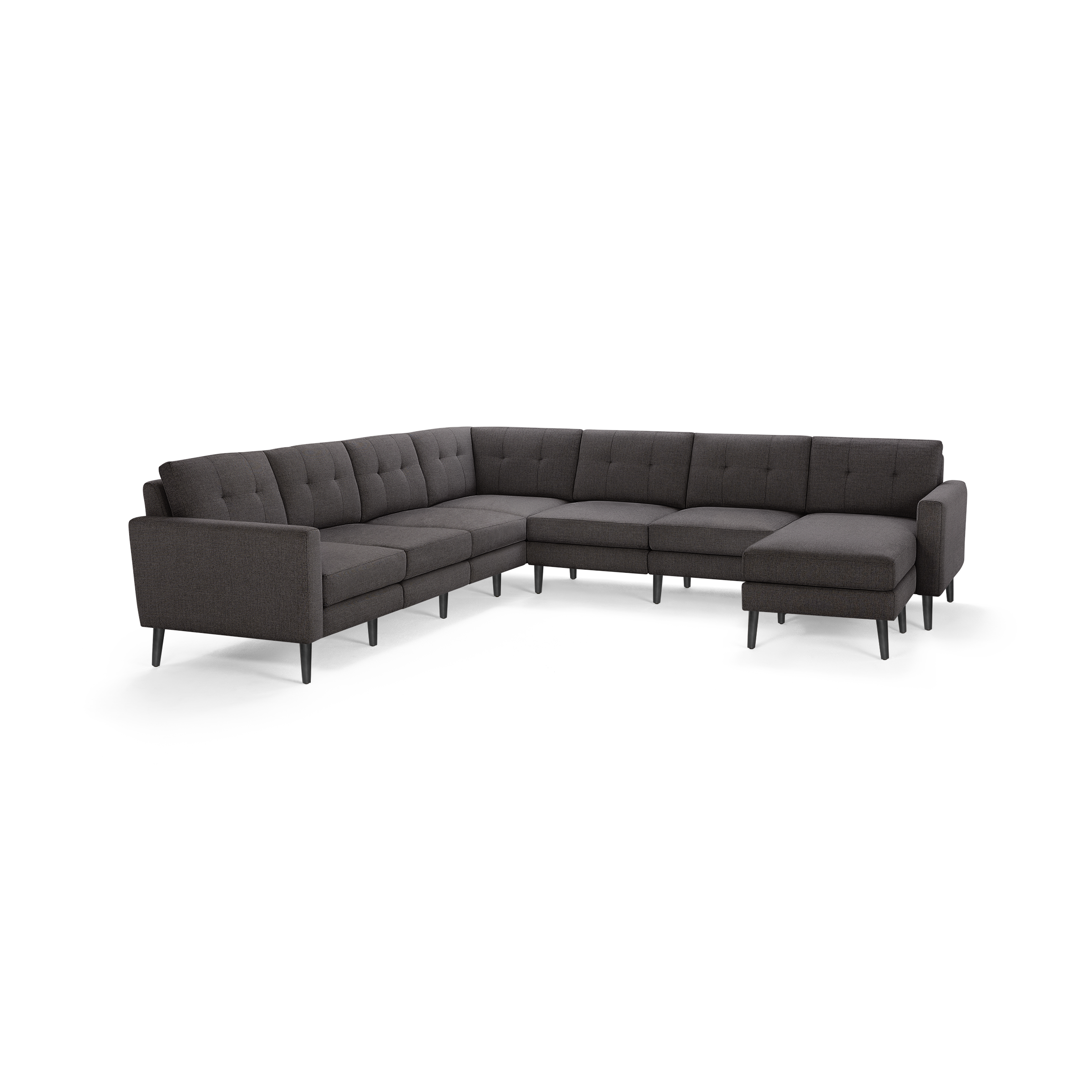 Dark gray L-shaped sectional sofa with tufted back cushions and slim black legs on a white background.
