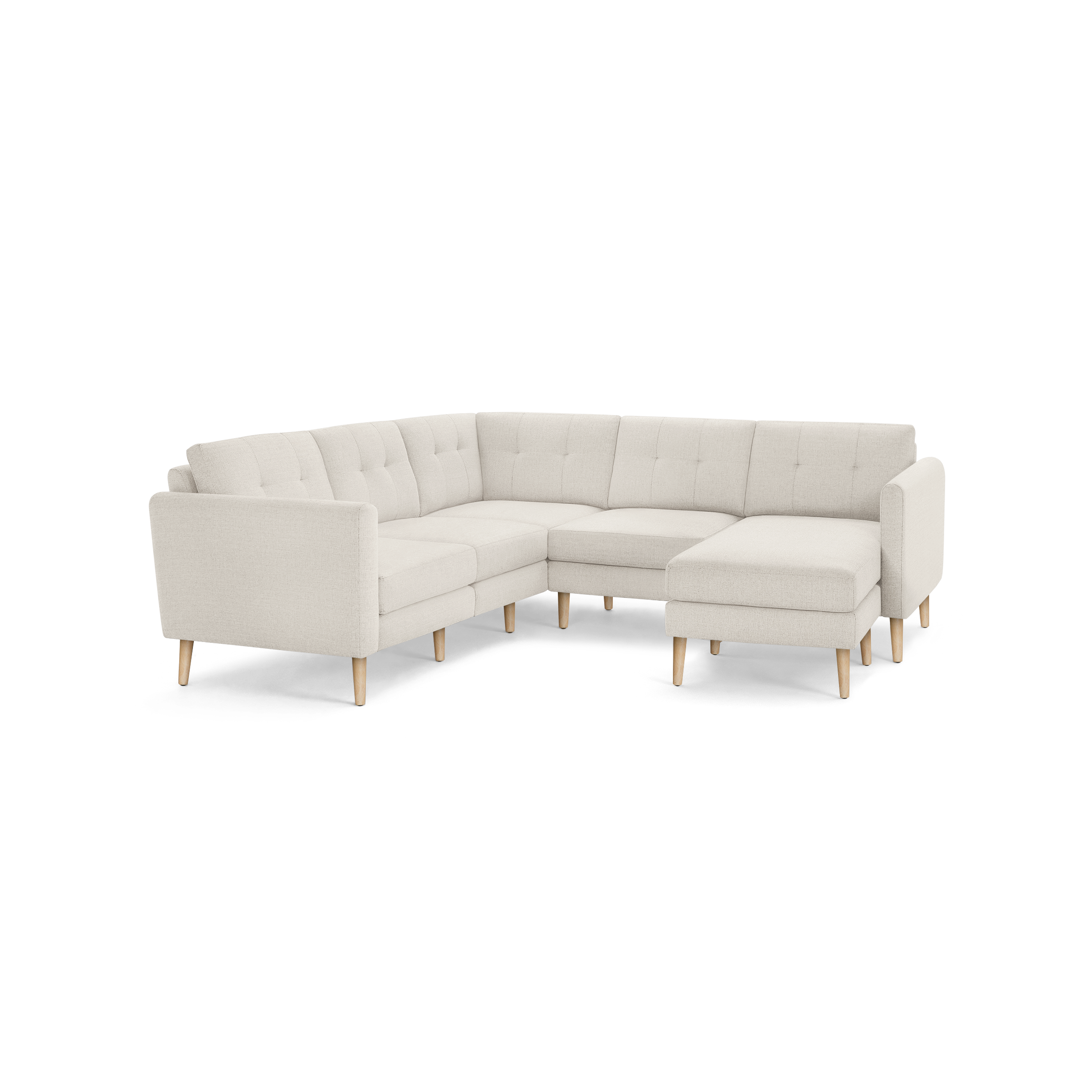 Light beige L-shaped sectional sofa with tufted back cushions and light wooden legs, modern minimalist design.