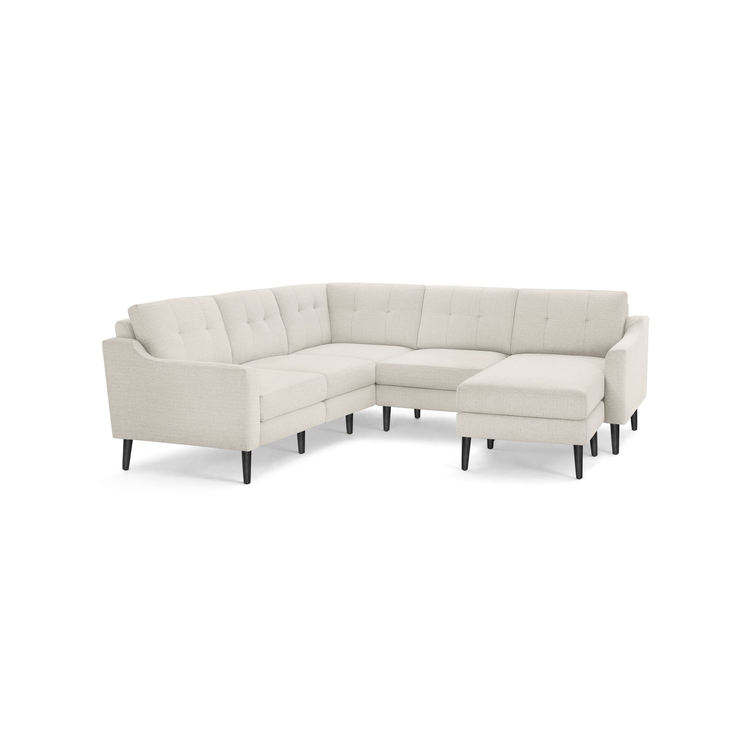 Light beige fabric sectional sofa with tufted back cushions, angled arms, and black tapered wooden legs.
