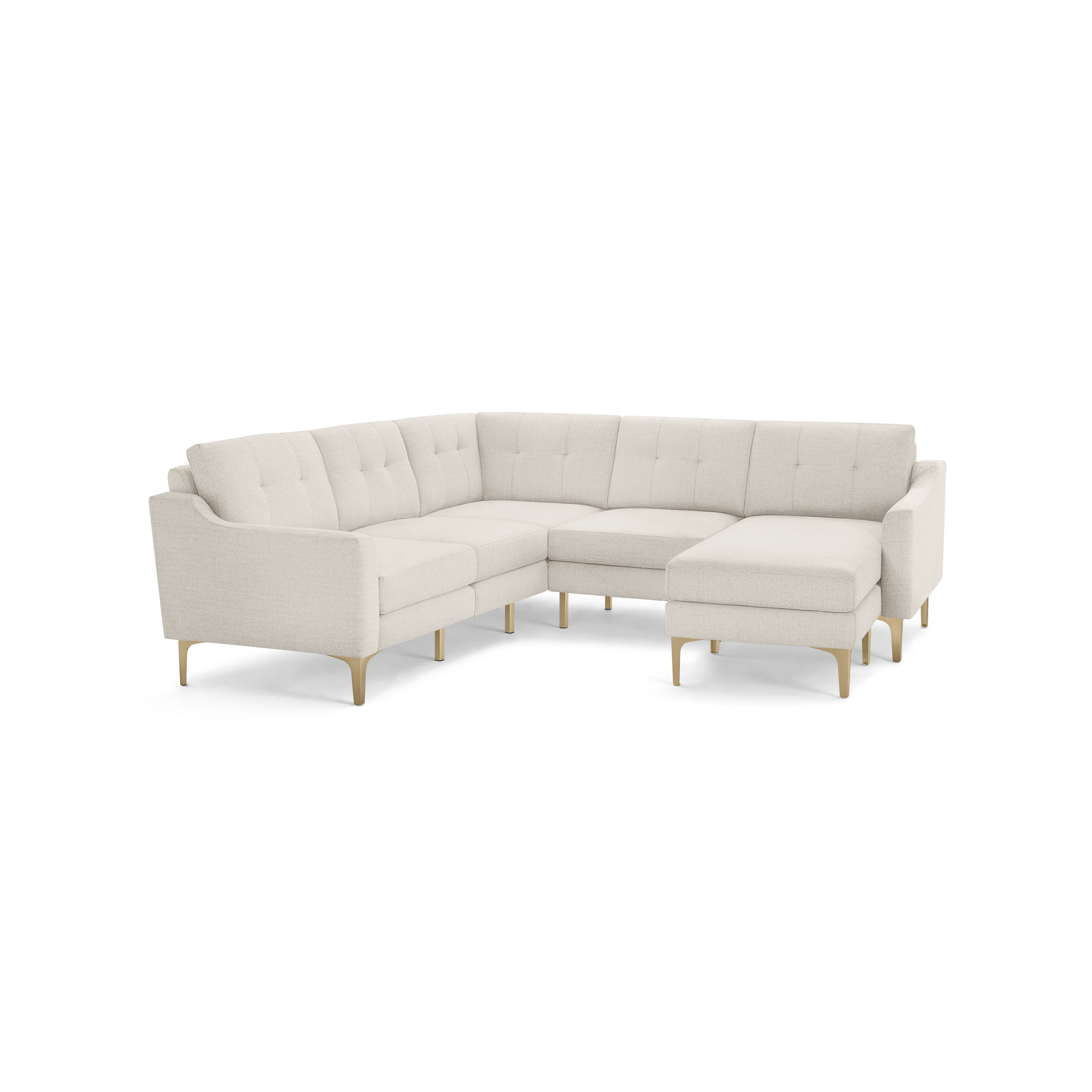 Modern L-shaped sectional sofa in light beige fabric with tufted back cushions and wooden legs on a black background.