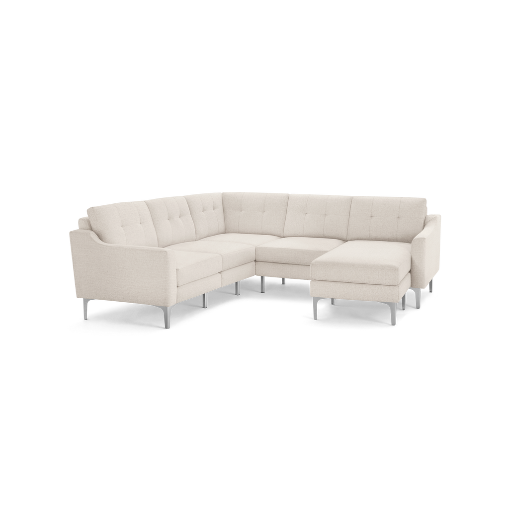 Modern beige fabric sectional sofa with tufted backrests, slim armrests, and metal legs, featuring a right-side chaise lounge.