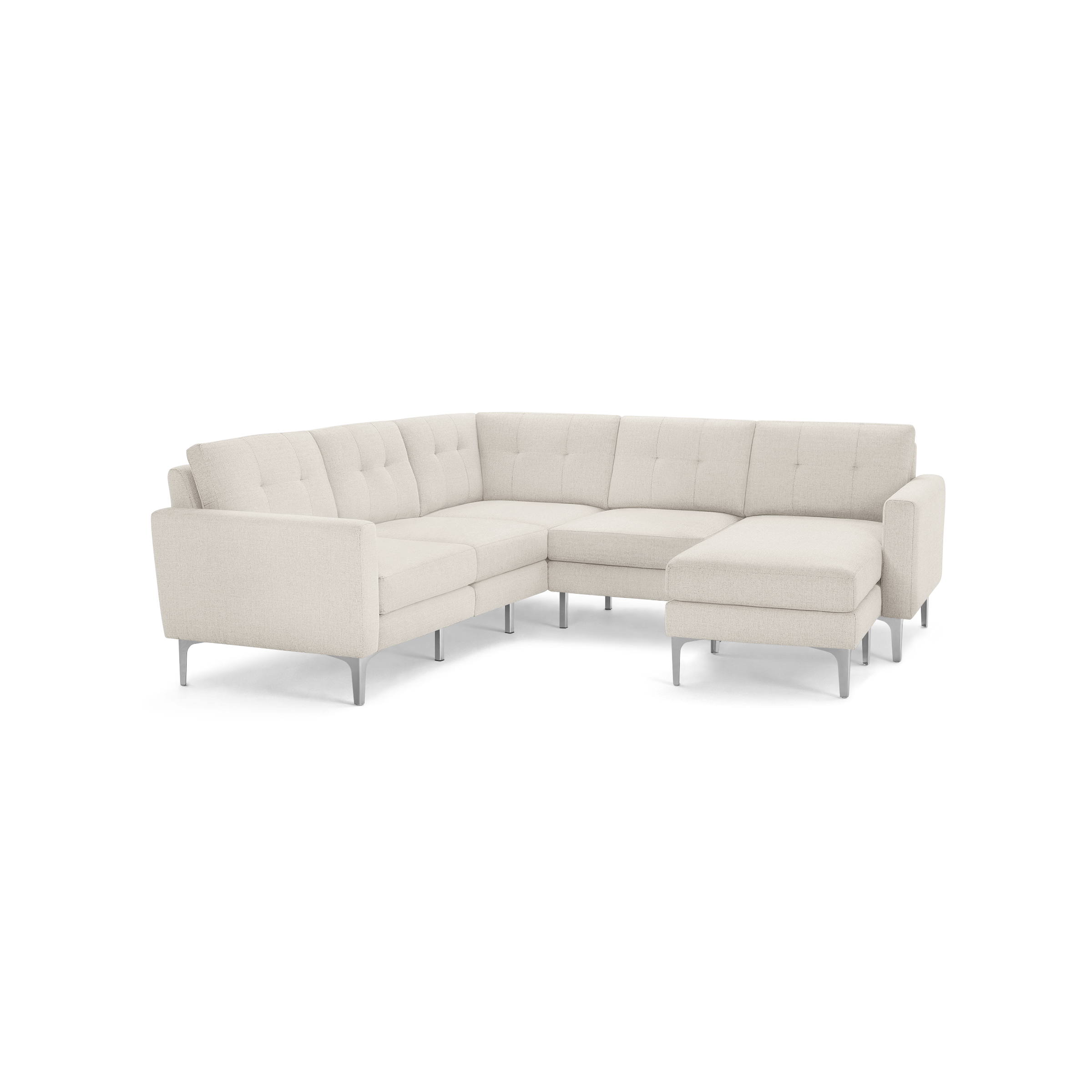 Cream-colored modern sectional sofa with tufted back cushions and slim metal legs, featuring a chaise lounge on the right side.
