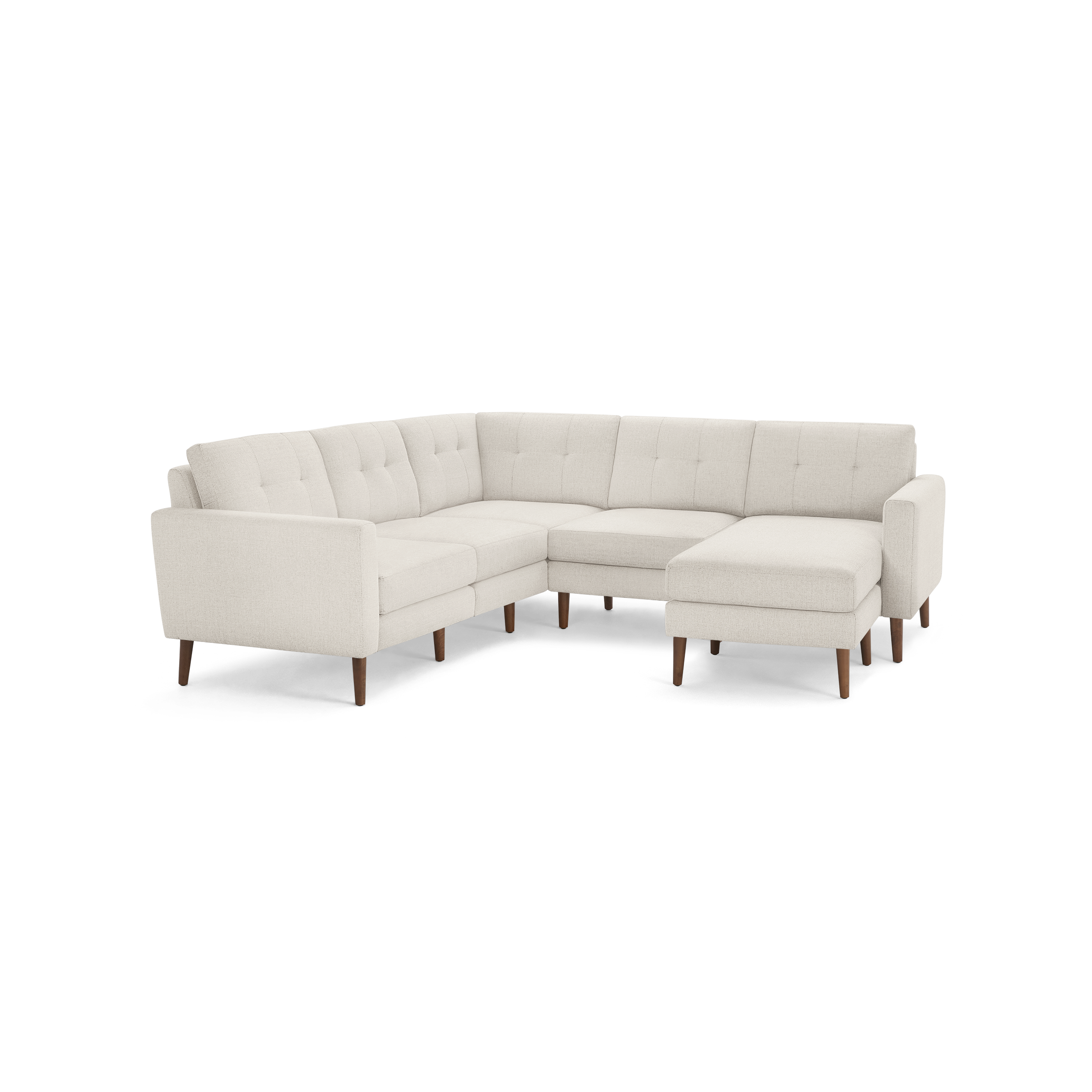 Beige fabric L-shaped sectional sofa with tufted cushions and wooden tapered legs, featuring an extended chaise on the right side.