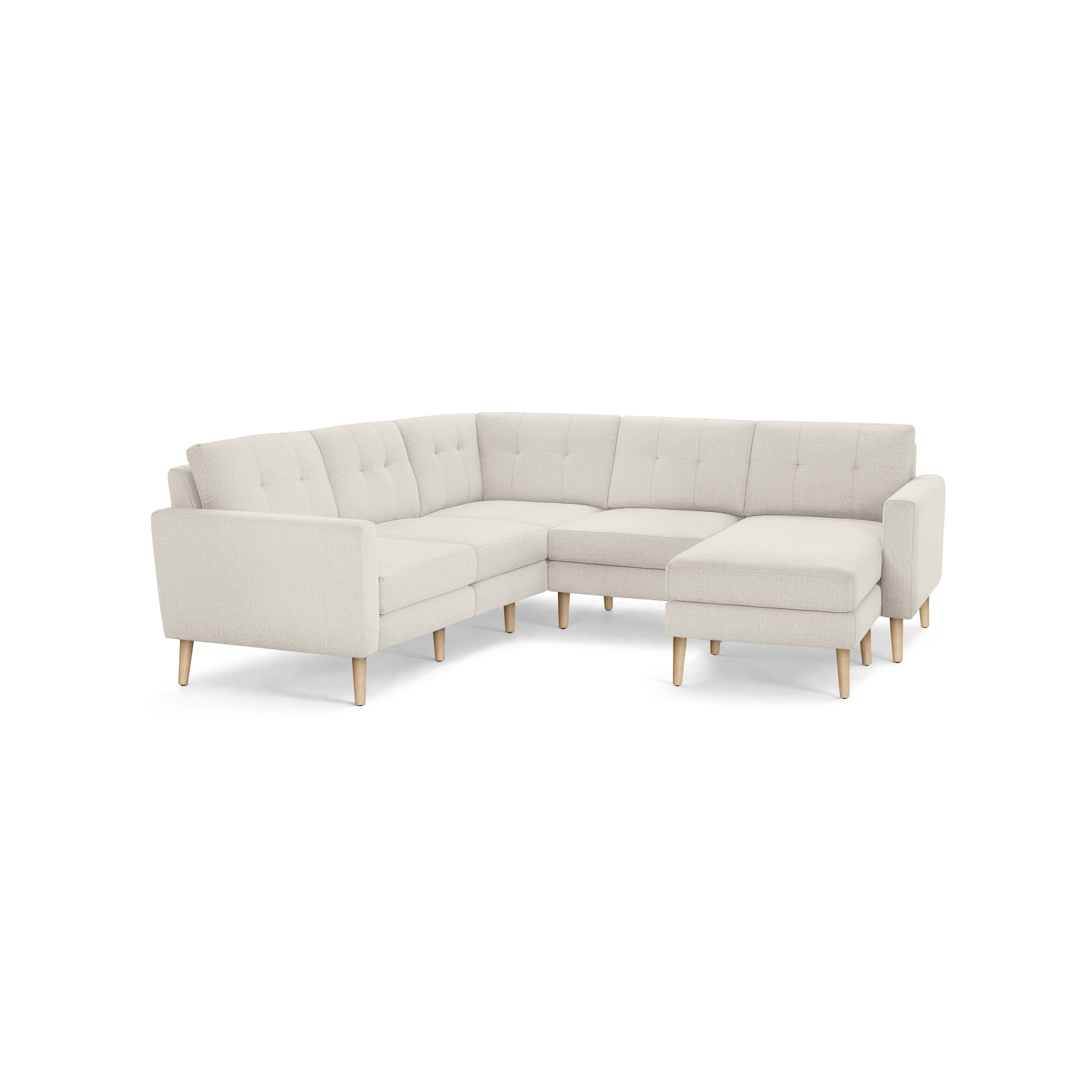 Beige fabric L-shaped sectional sofa with tufted back cushions and natural wood tapered legs.