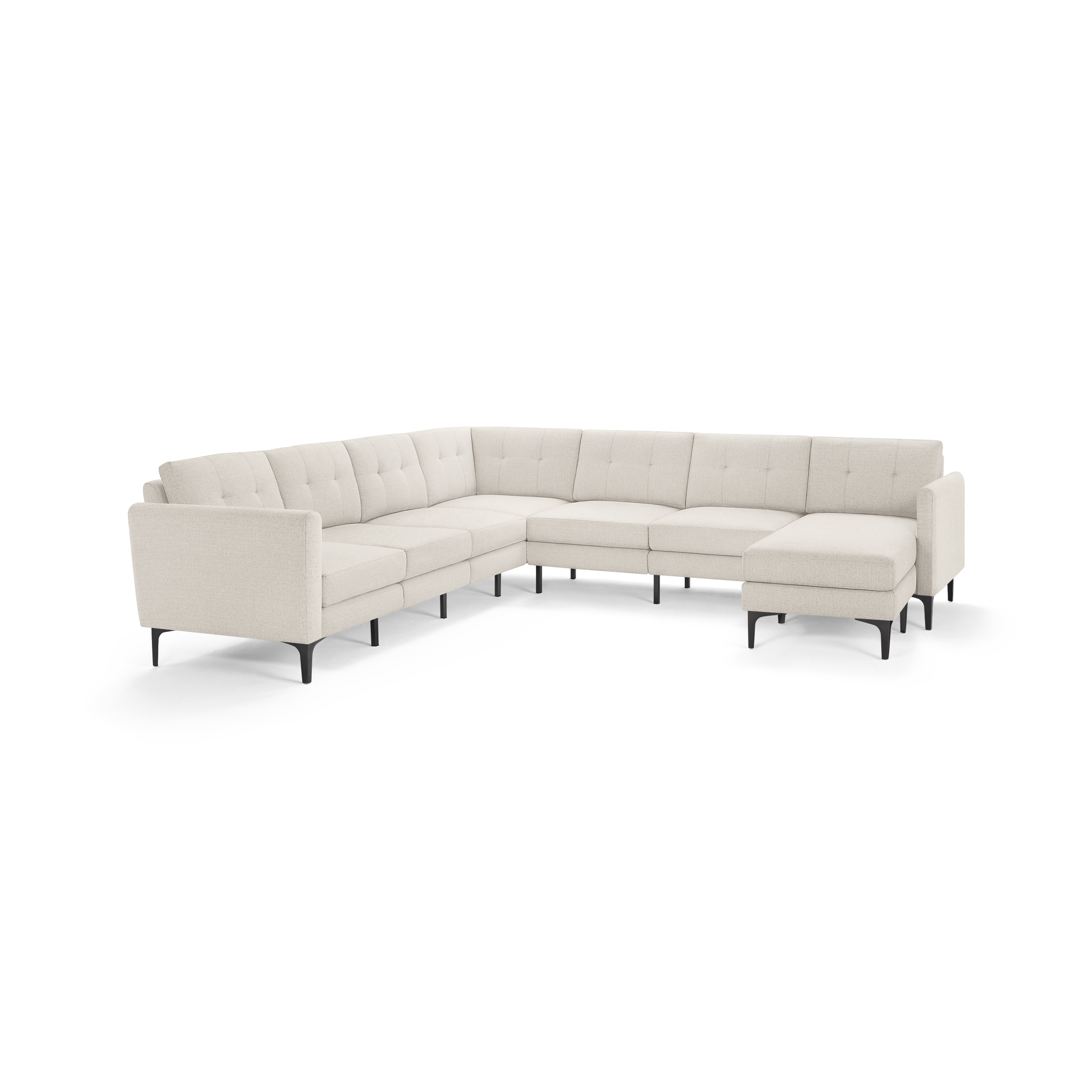 Light beige L-shaped sectional sofa with tufted back cushions, slim black legs, and a modern minimalist design.