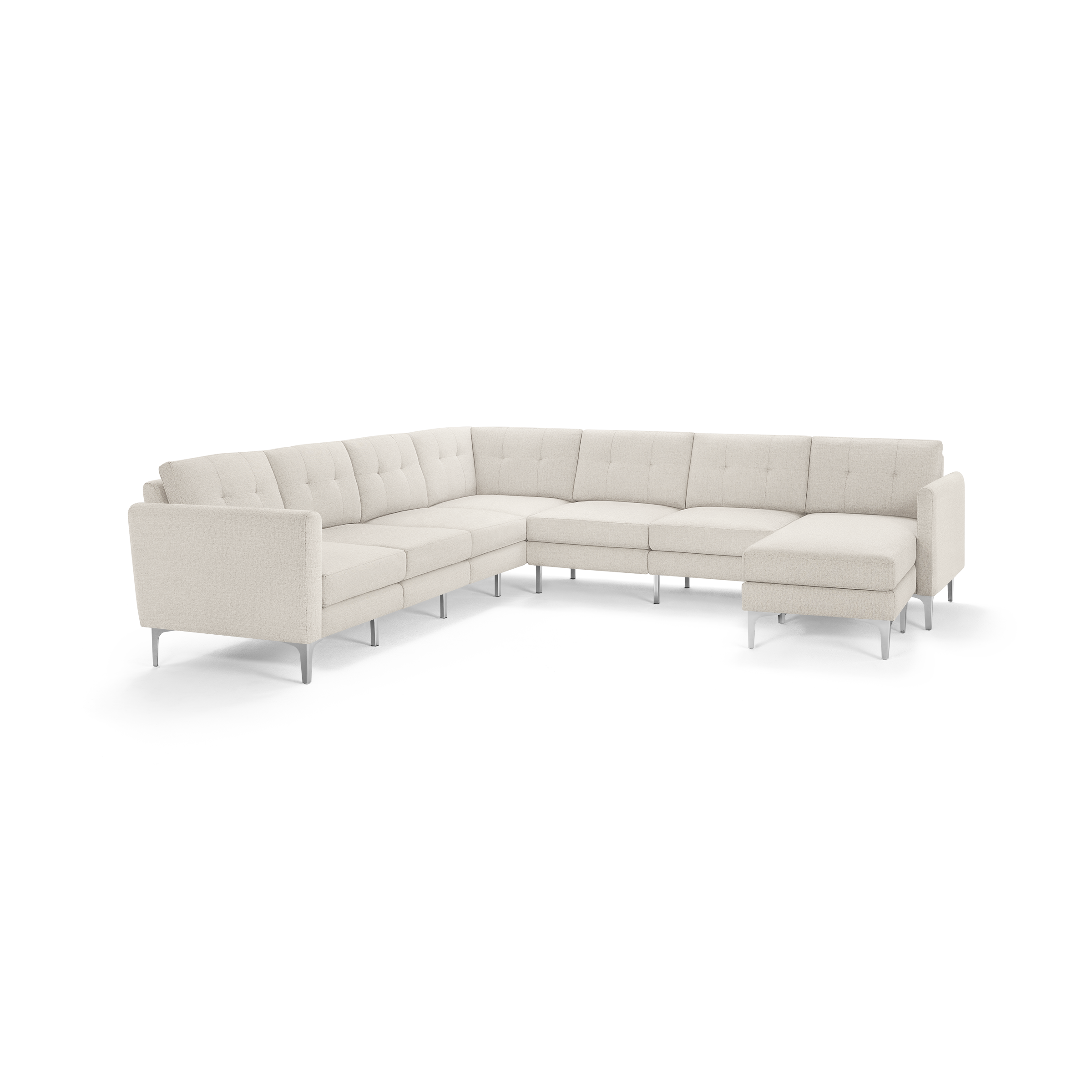 Beige L-shaped sectional sofa with tufted cushions and metal legs, featuring a chaise lounge on the right side.