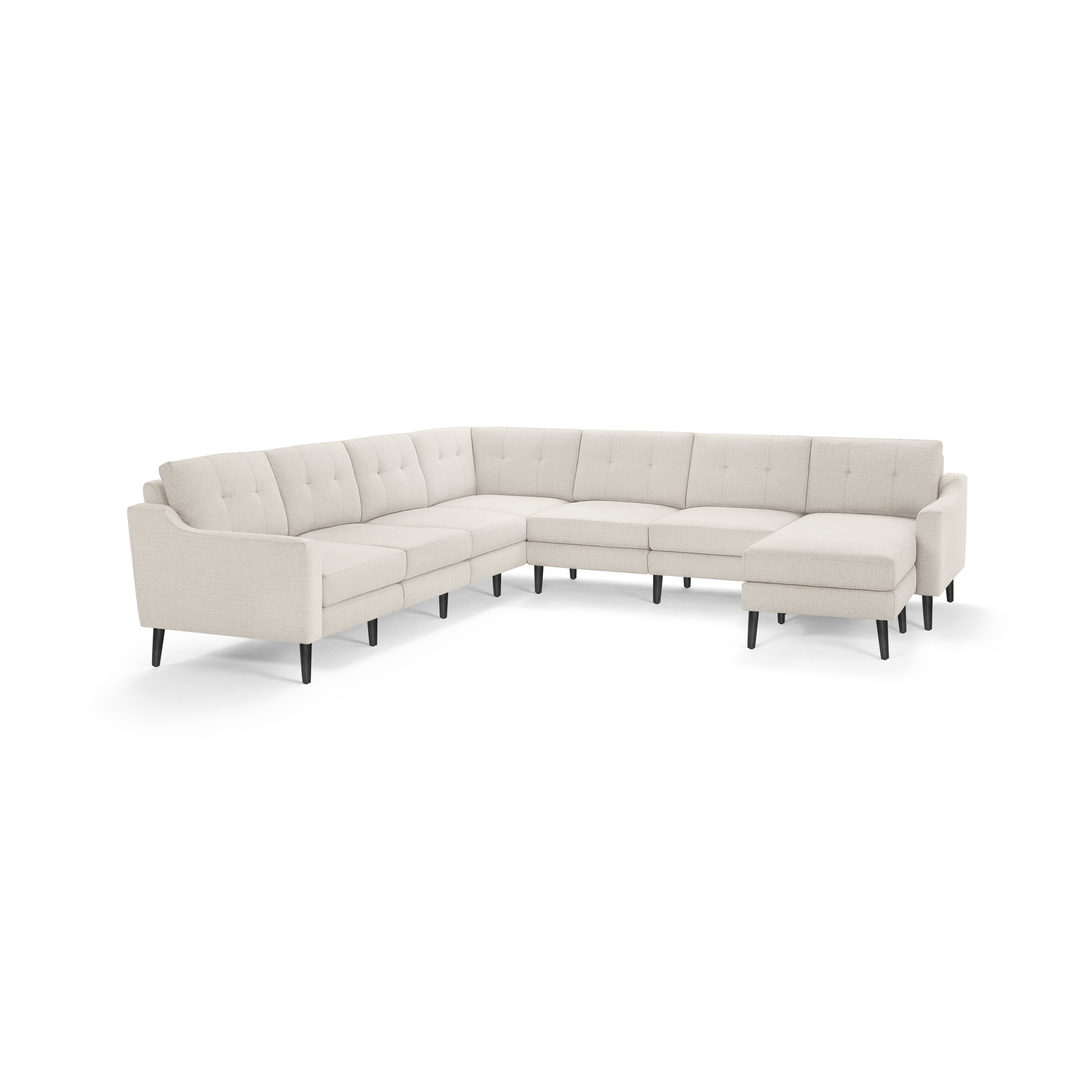 Beige L-shaped sectional sofa with tufted cushions, slim armrests, and black tapered legs, designed for spacious seating.