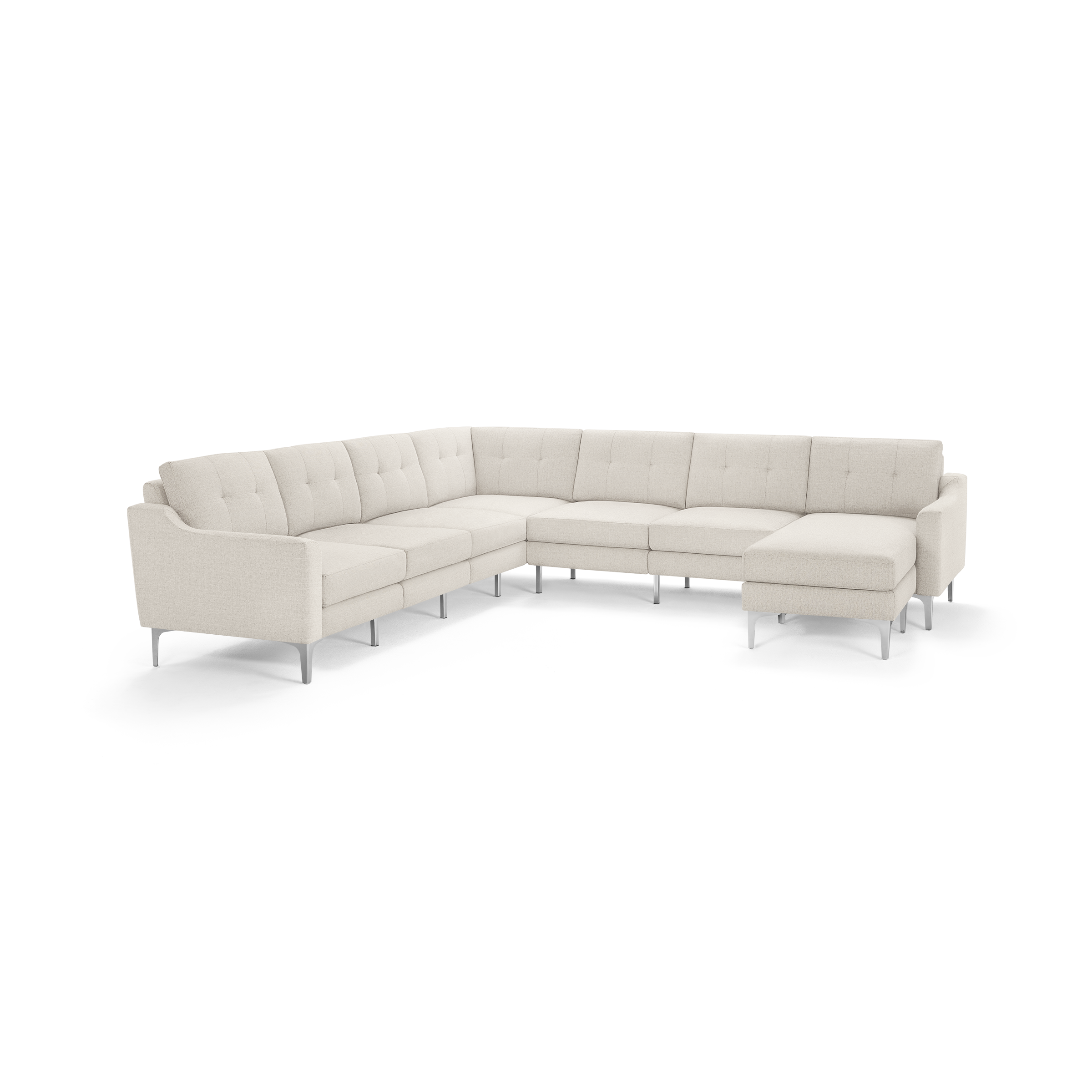 Large L-shaped sectional sofa with beige fabric upholstery, tufted cushions, and sleek metal legs, featuring a chaise lounge on one end.