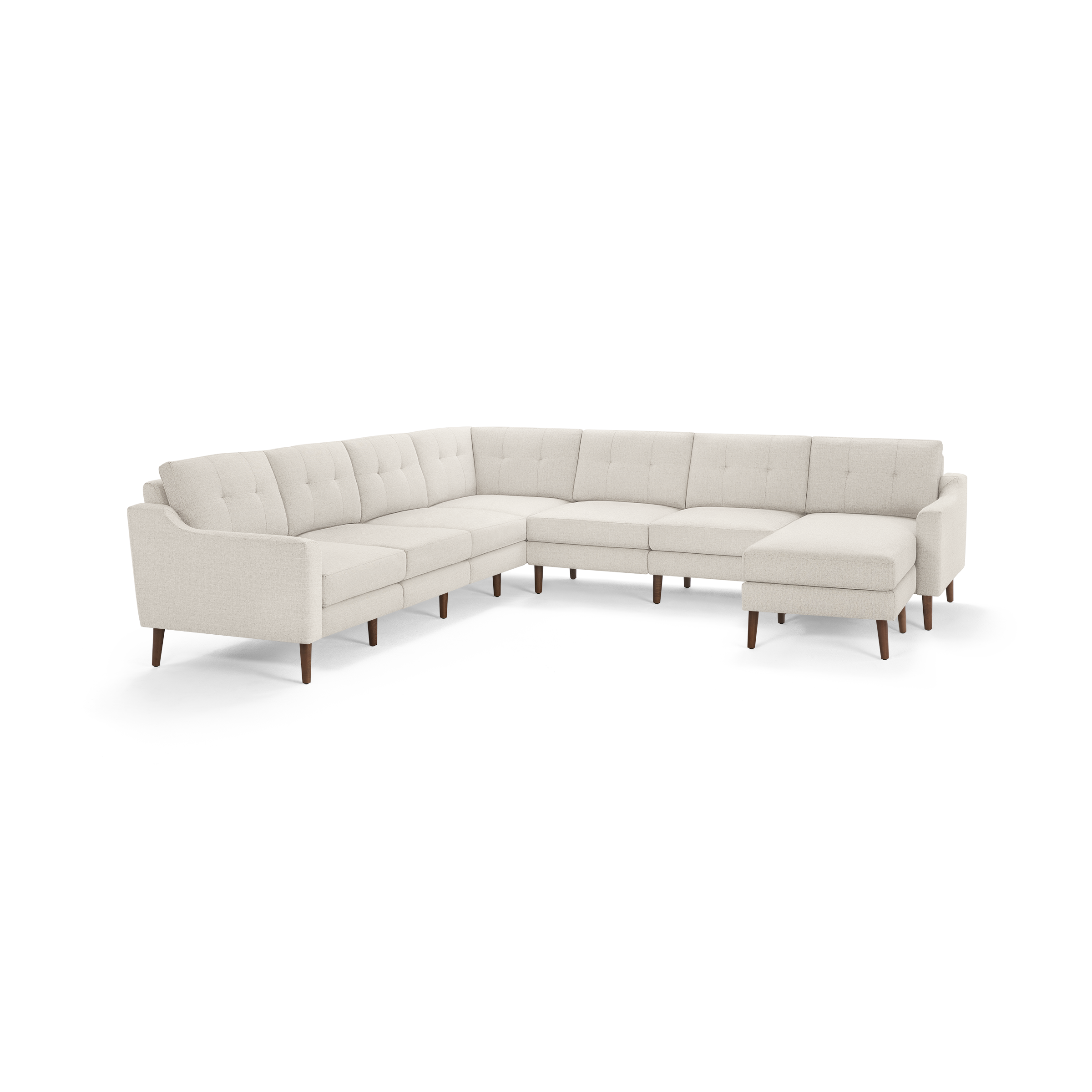 Large beige L-shaped sectional sofa with button-tufted cushions and wooden legs on a white background.