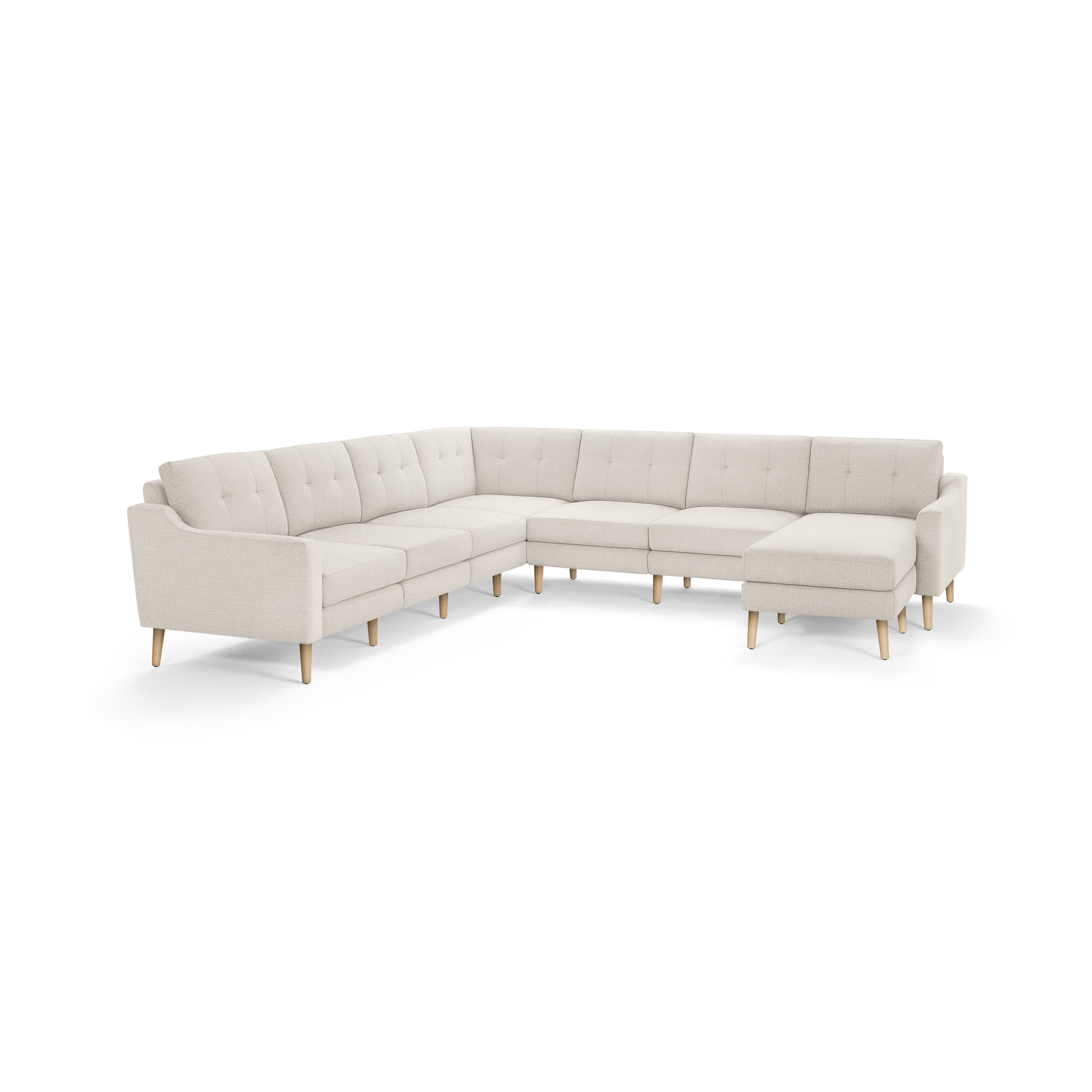 Light beige L-shaped sectional sofa with tufted back cushions and wooden legs, designed for spacious seating and modern comfort.