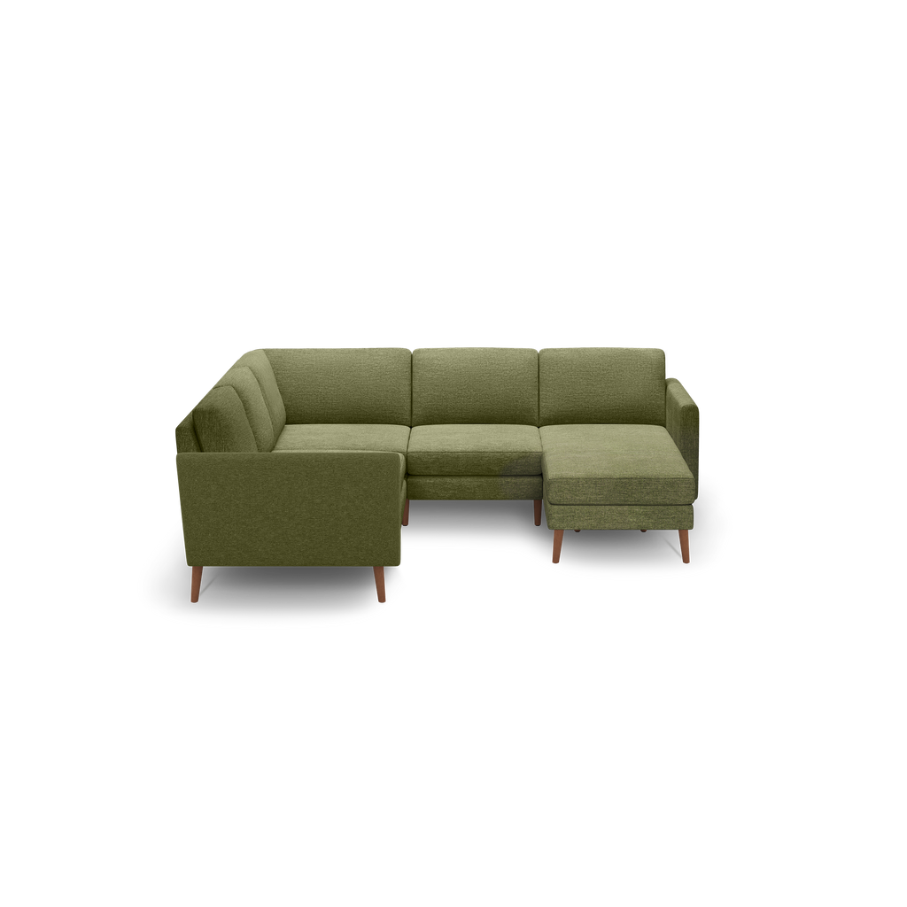 Olive green L-shaped sectional sofa with wooden legs, tufted cushions, and a modern minimalist design.