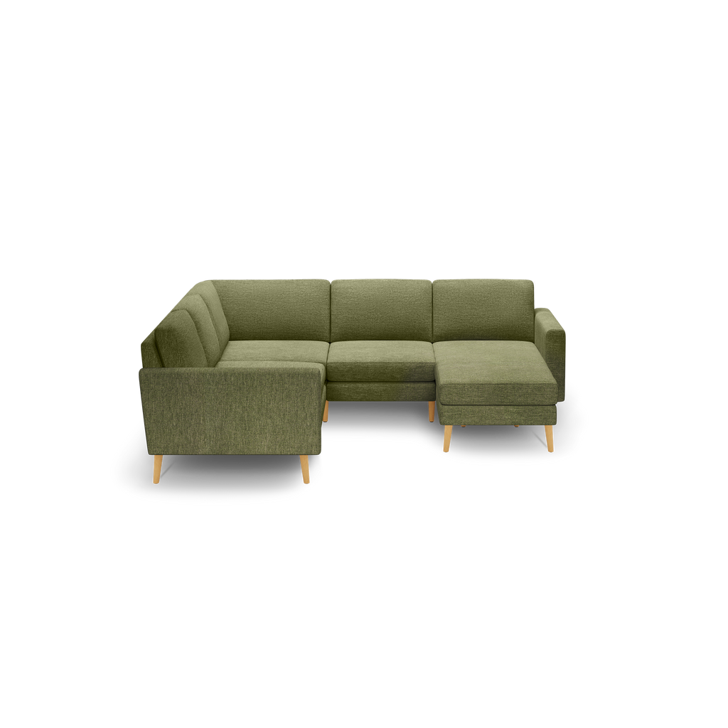 Green fabric L-shaped sectional sofa with wooden legs, cushioned seats, and backrests, featuring a right-side chaise lounge.