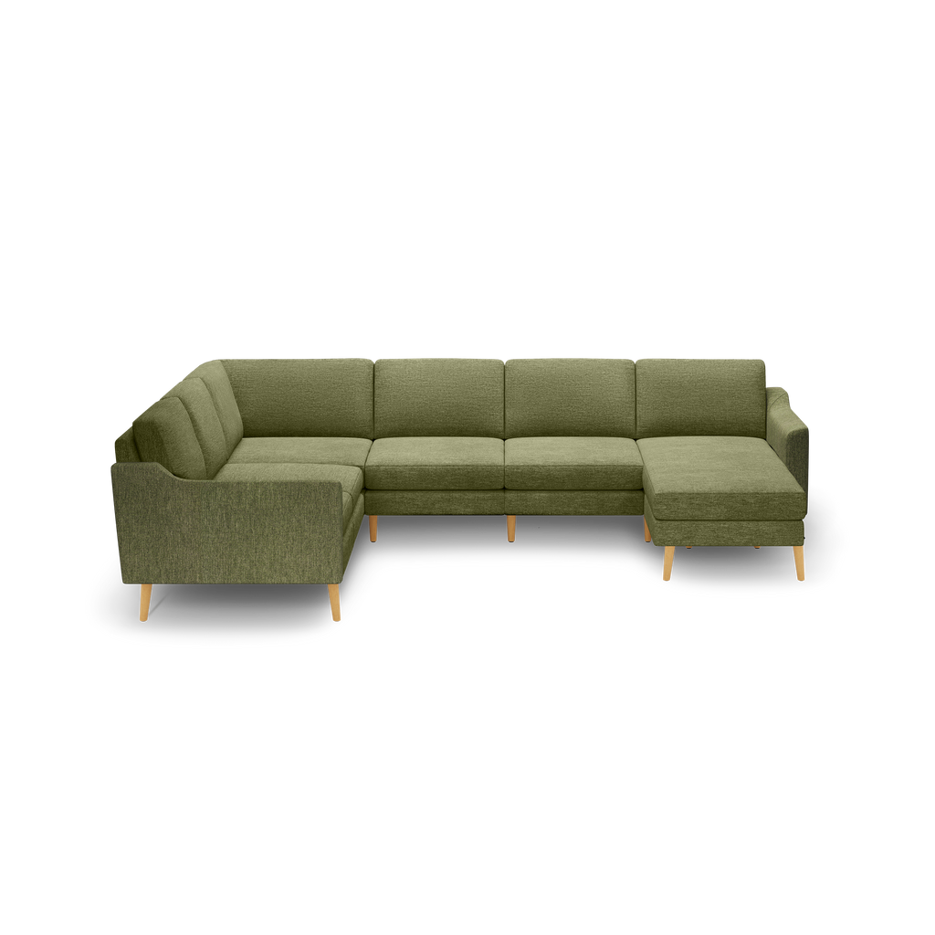 Olive green L-shaped sectional sofa with wooden legs and tufted cushions, designed for spacious seating.