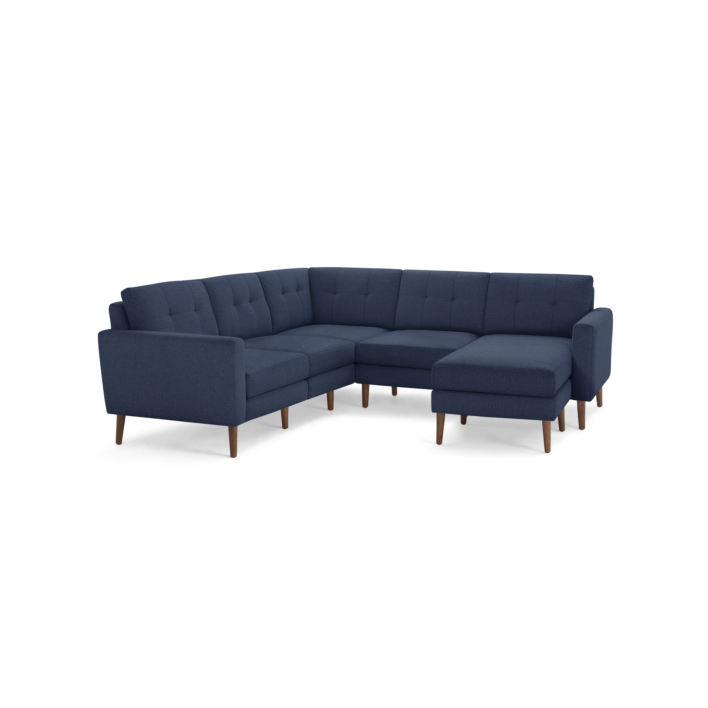 Dark blue fabric sectional sofa with tufted back cushions, wooden legs, and a right-side chaise lounge.