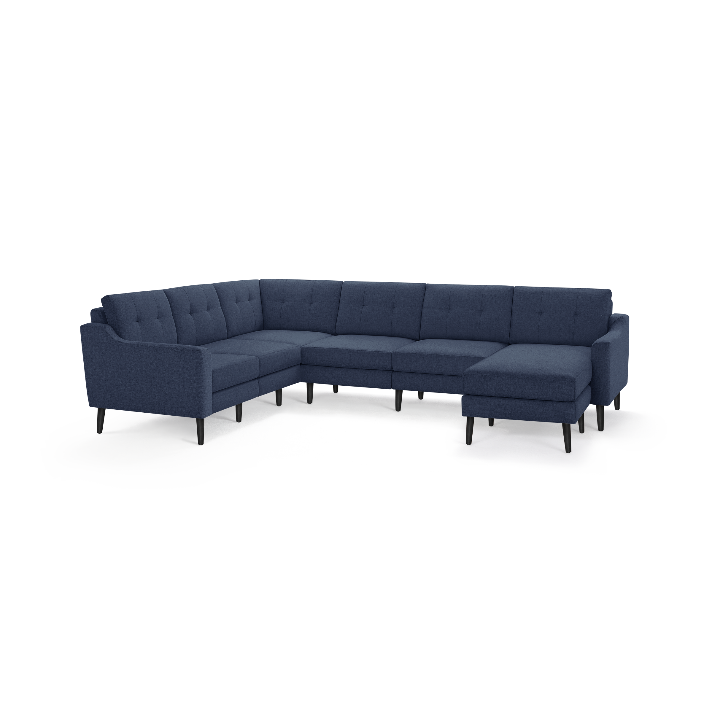 Modern sectional sofa with deep blue fabric upholstery, tufted back cushions, and black tapered wooden legs.