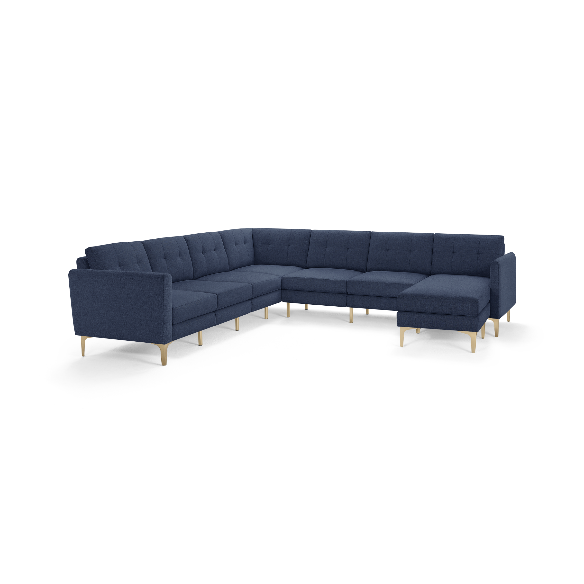 Large L-shaped sectional sofa with navy blue tufted cushions and light wooden legs, offering modern and spacious seating.