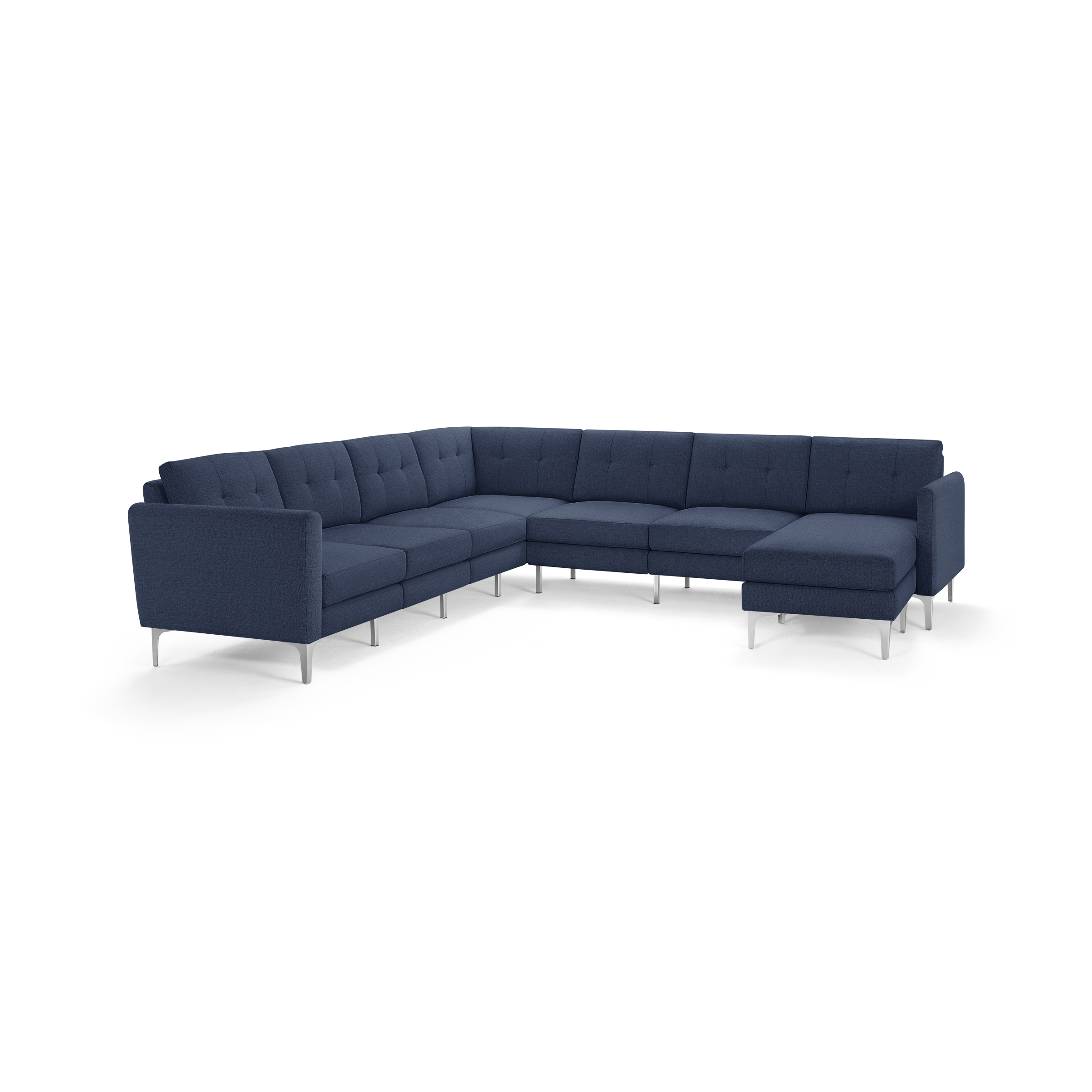 Large modern L-shaped sectional sofa with deep blue fabric upholstery and metal legs, featuring tufted back cushions.