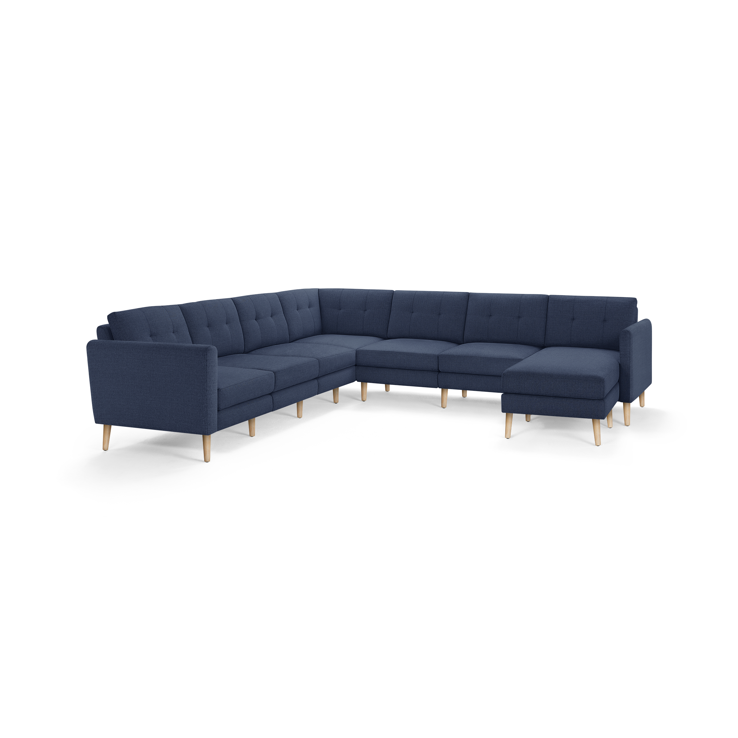 Large navy blue L-shaped sectional sofa with tufted cushions and light wooden tapered legs, offering a modern, comfortable design.