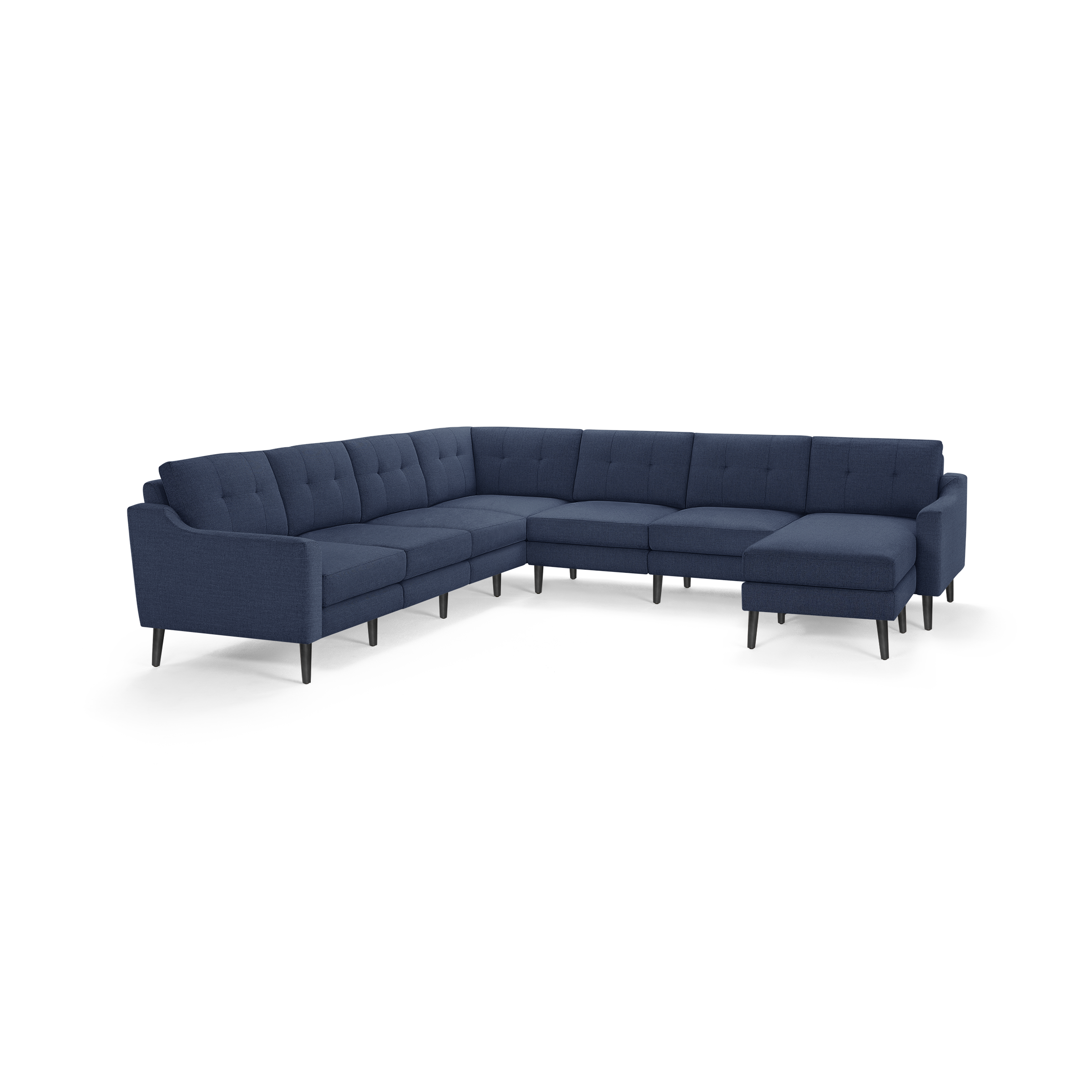 Large modern sectional sofa in dark blue fabric with tufted back cushions and slim black legs, designed for spacious seating.
