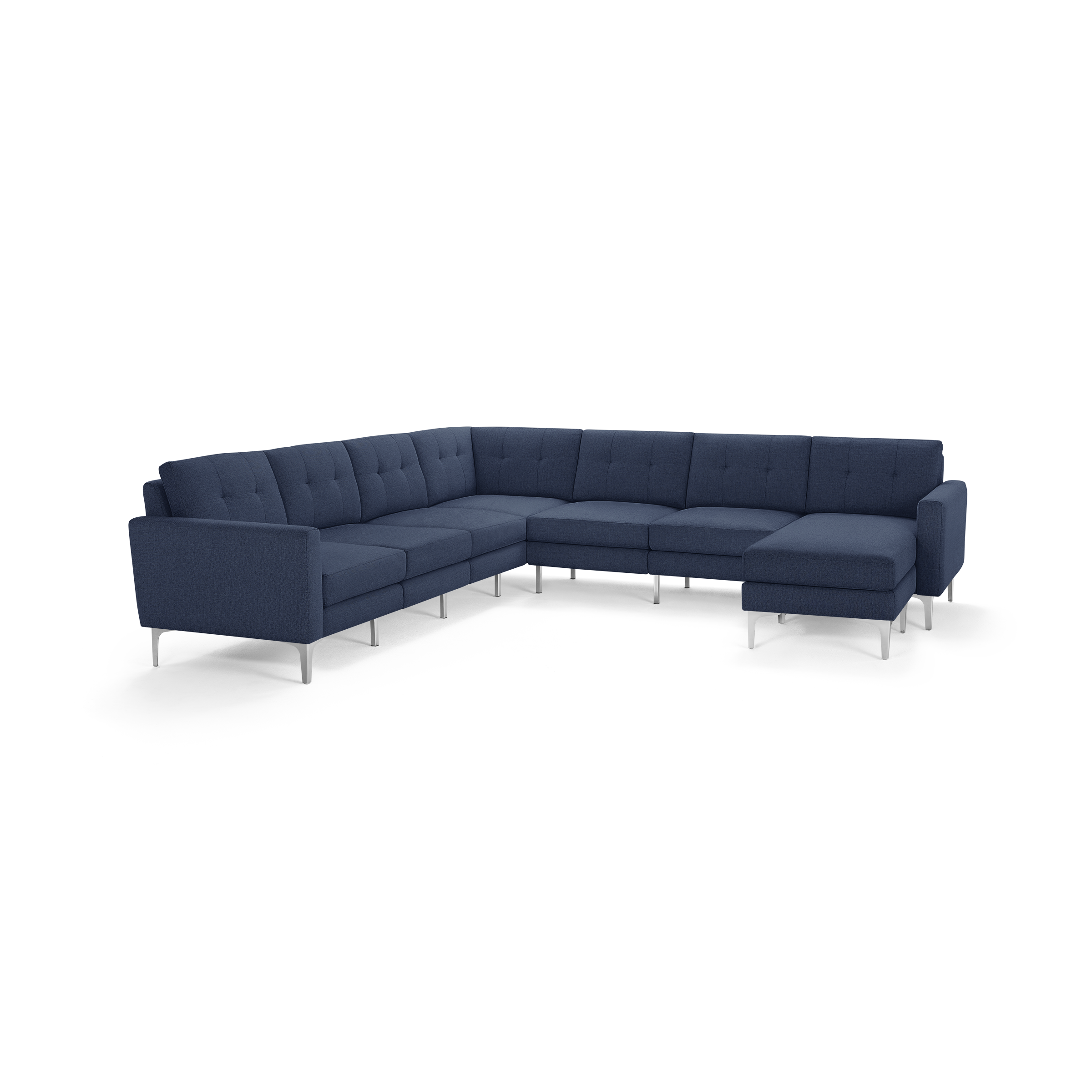 Large modern L-shaped sectional sofa in navy blue fabric upholstery with tufted back cushions and slim metal legs.