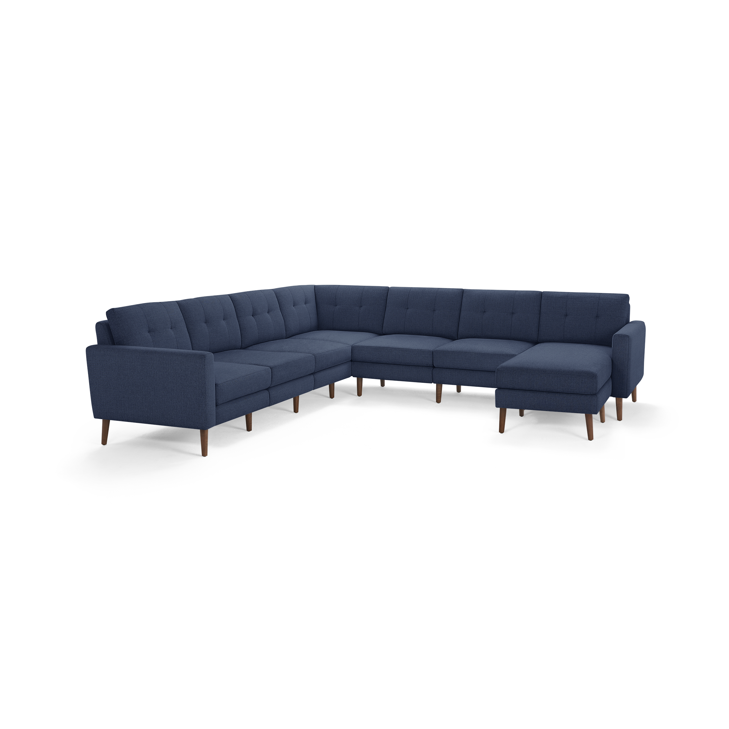 Large navy blue L-shaped sectional sofa with tufted back cushions and wooden legs, offering ample seating space.