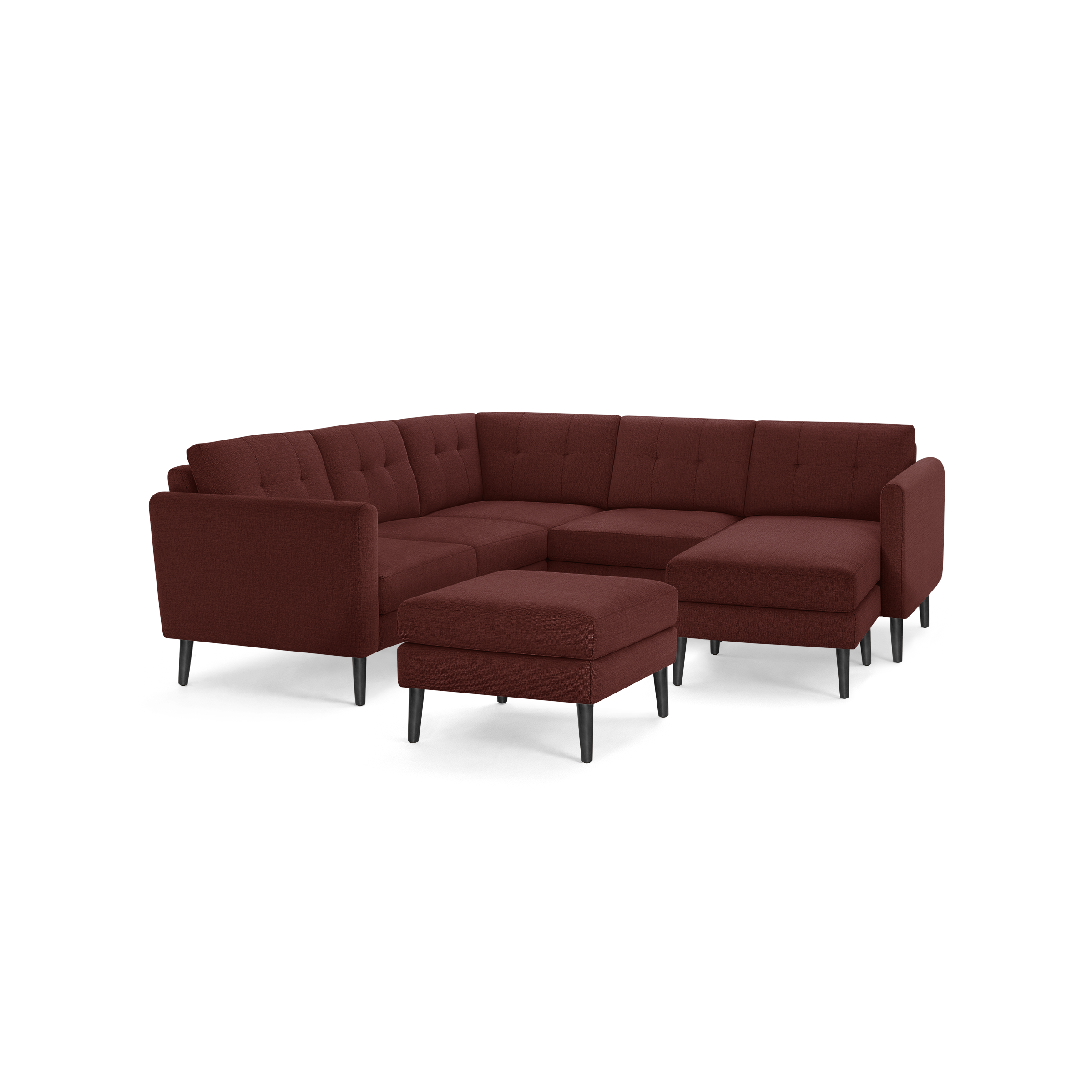 Modern L-shaped sectional sofa in deep red fabric with tufted cushions, black tapered legs, and matching ottoman.