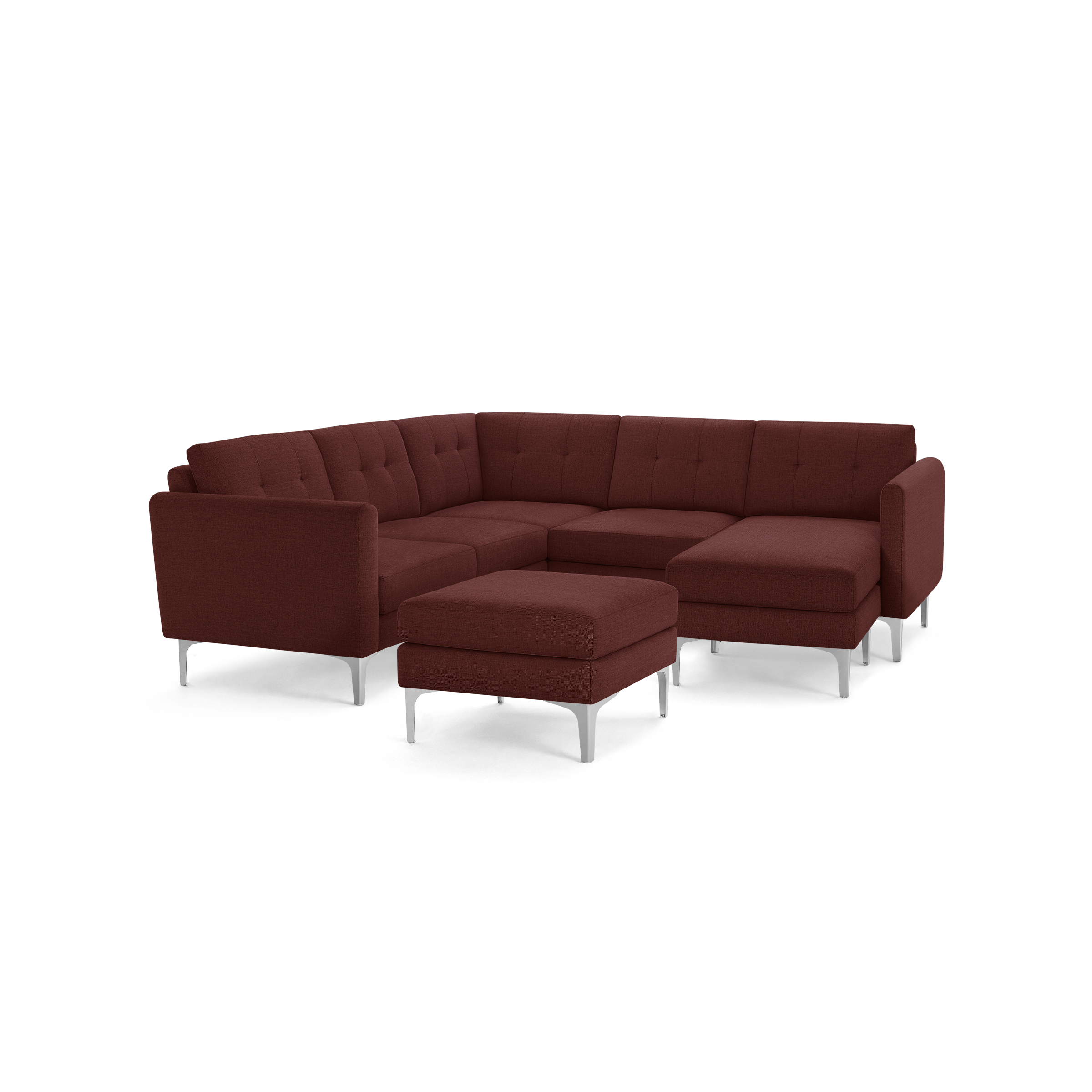 Modern rust-colored sectional sofa with tufted cushions, a matching ottoman, and sleek metal legs designed for spacious comfort.