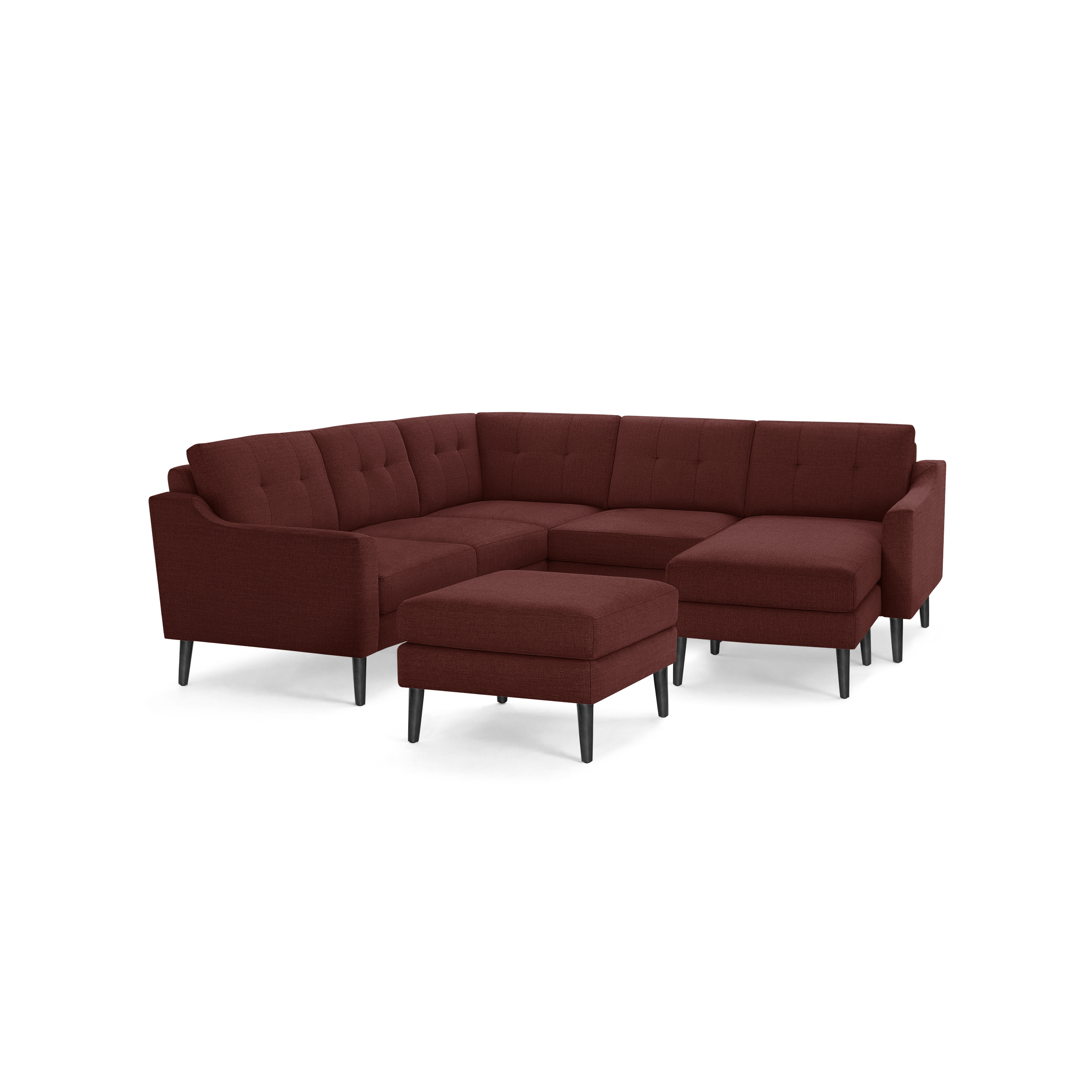 Modern sectional sofa with deep red fabric upholstery, button-tufted cushions, black tapered legs, and a matching ottoman.