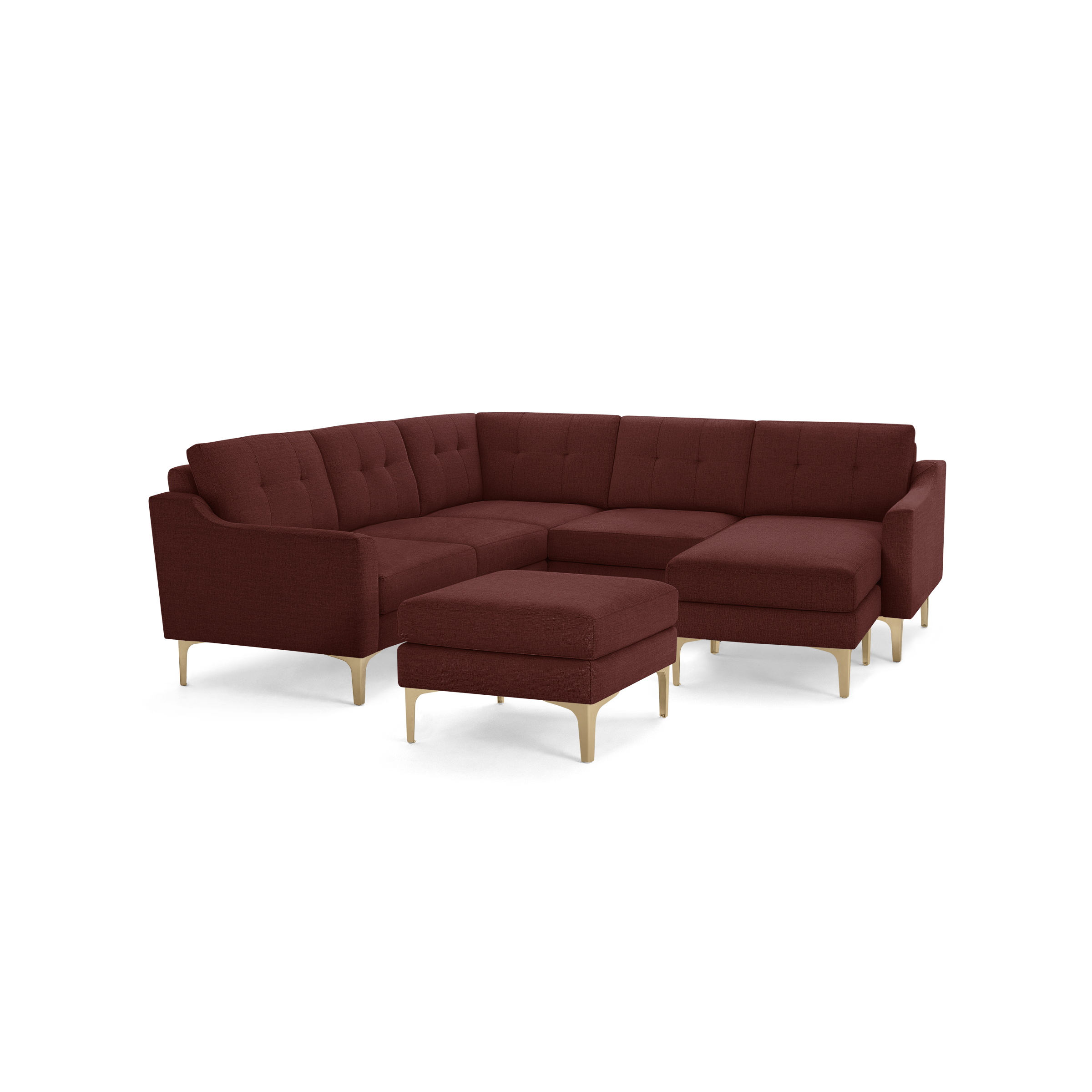 Modern L-shaped sectional sofa in dark red upholstery with tufted cushions and light wooden legs, includes matching ottoman.