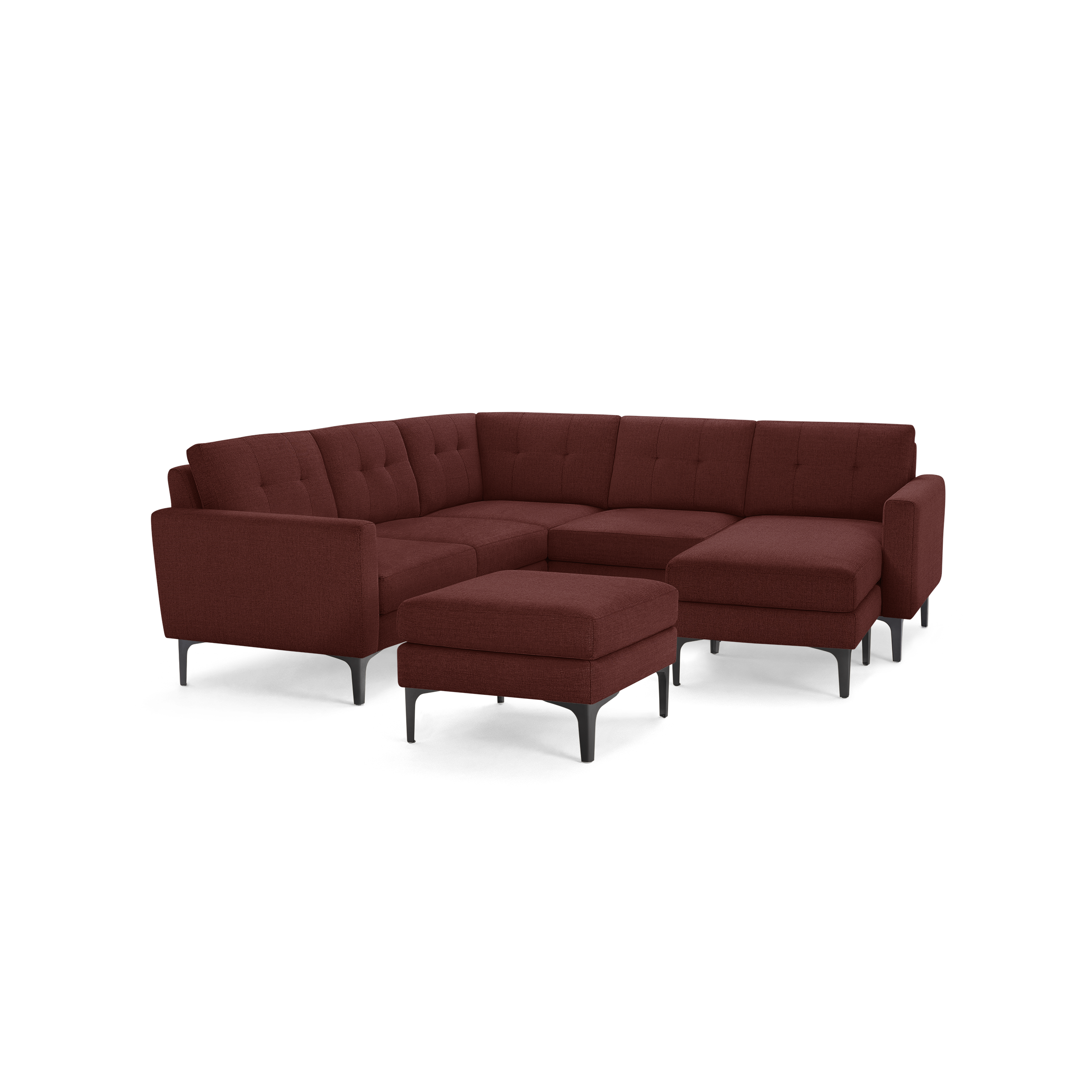 Modern L-shaped sectional sofa with tufted cushions, deep red fabric upholstery, metal legs, and matching ottoman.