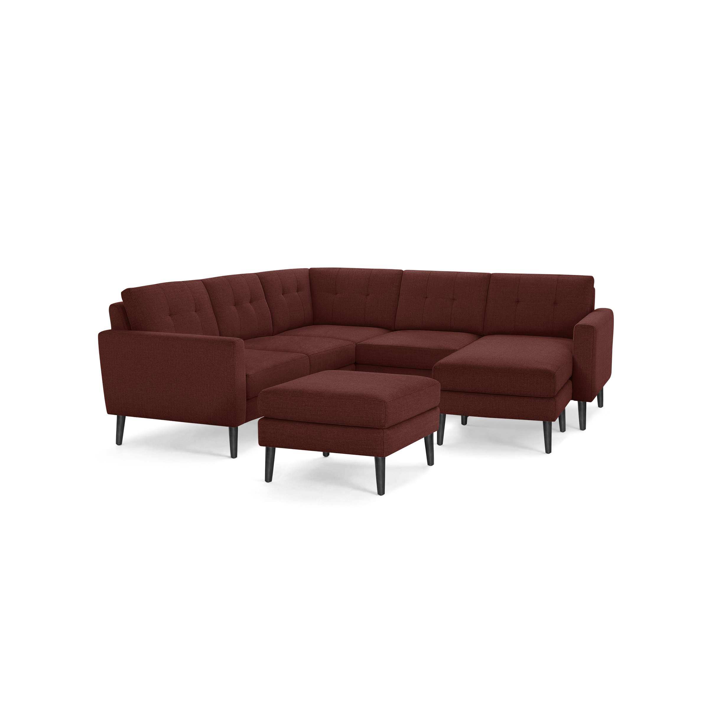 Modern sectional sofa set with dark red fabric upholstery, button tufting, angled armrests, black tapered wooden legs, and matching ottoman.
