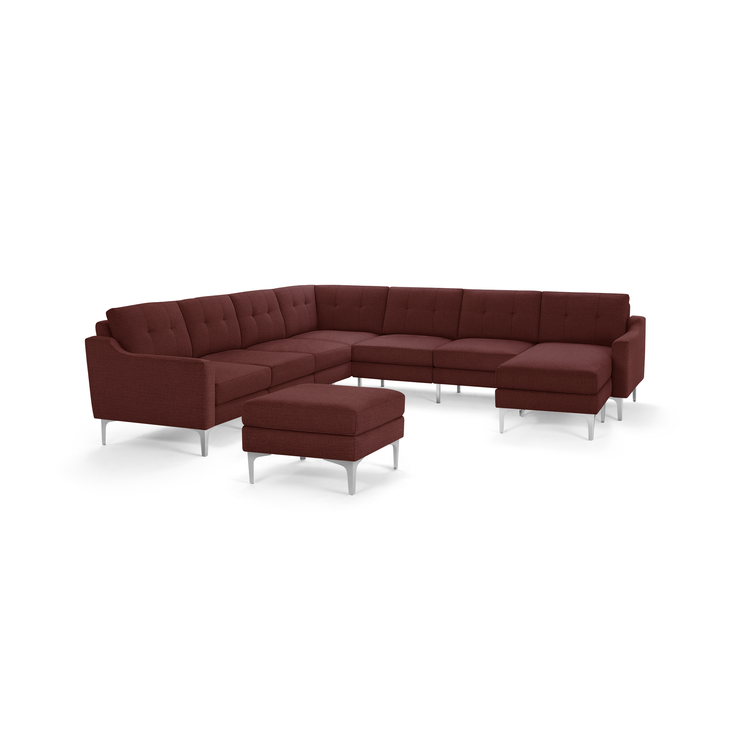 Modern L-shaped sectional sofa in deep red fabric with button tufting and silver metal legs, including a matching ottoman.