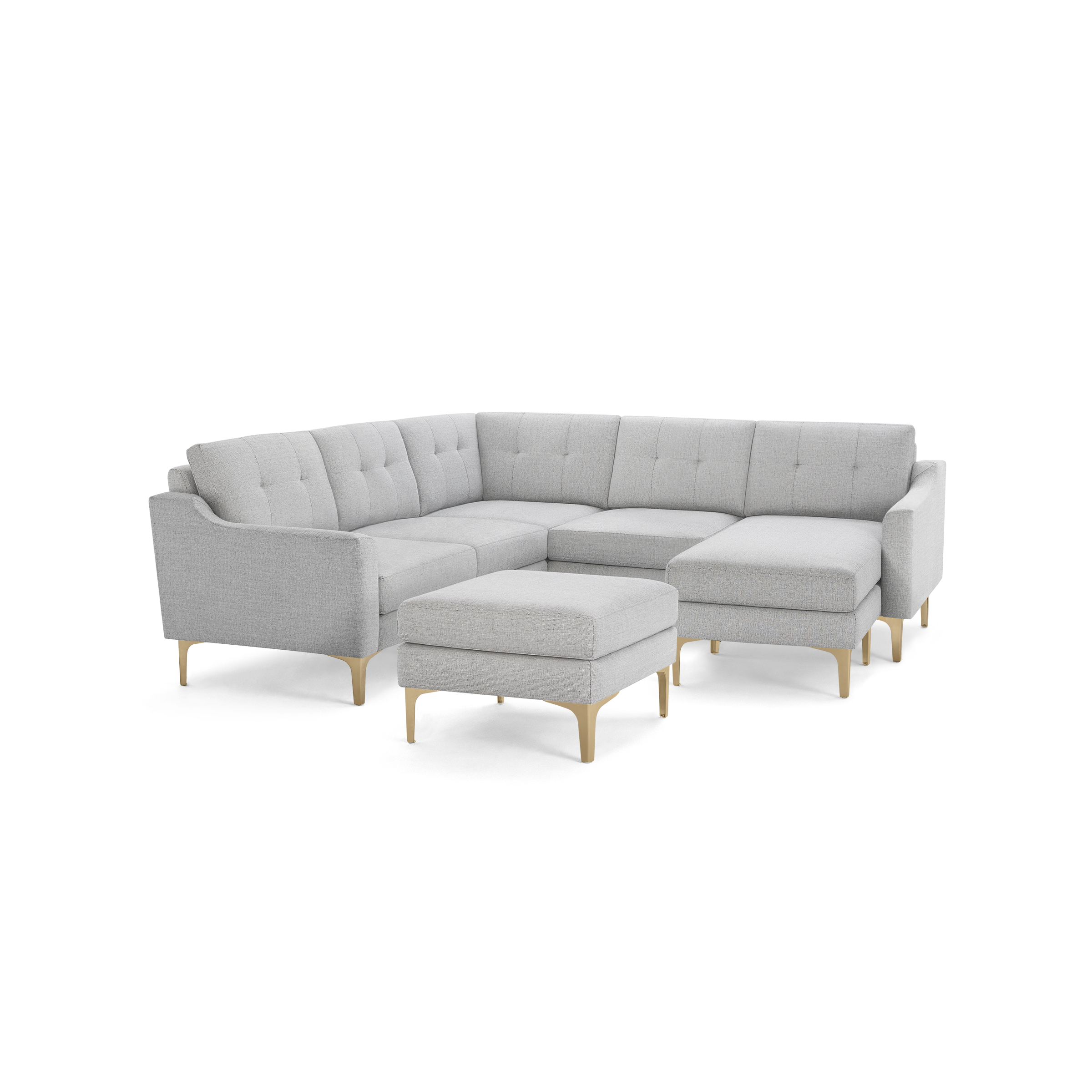 Light gray corner sectional sofa with tufted cushions, wooden legs, and a matching square ottoman.