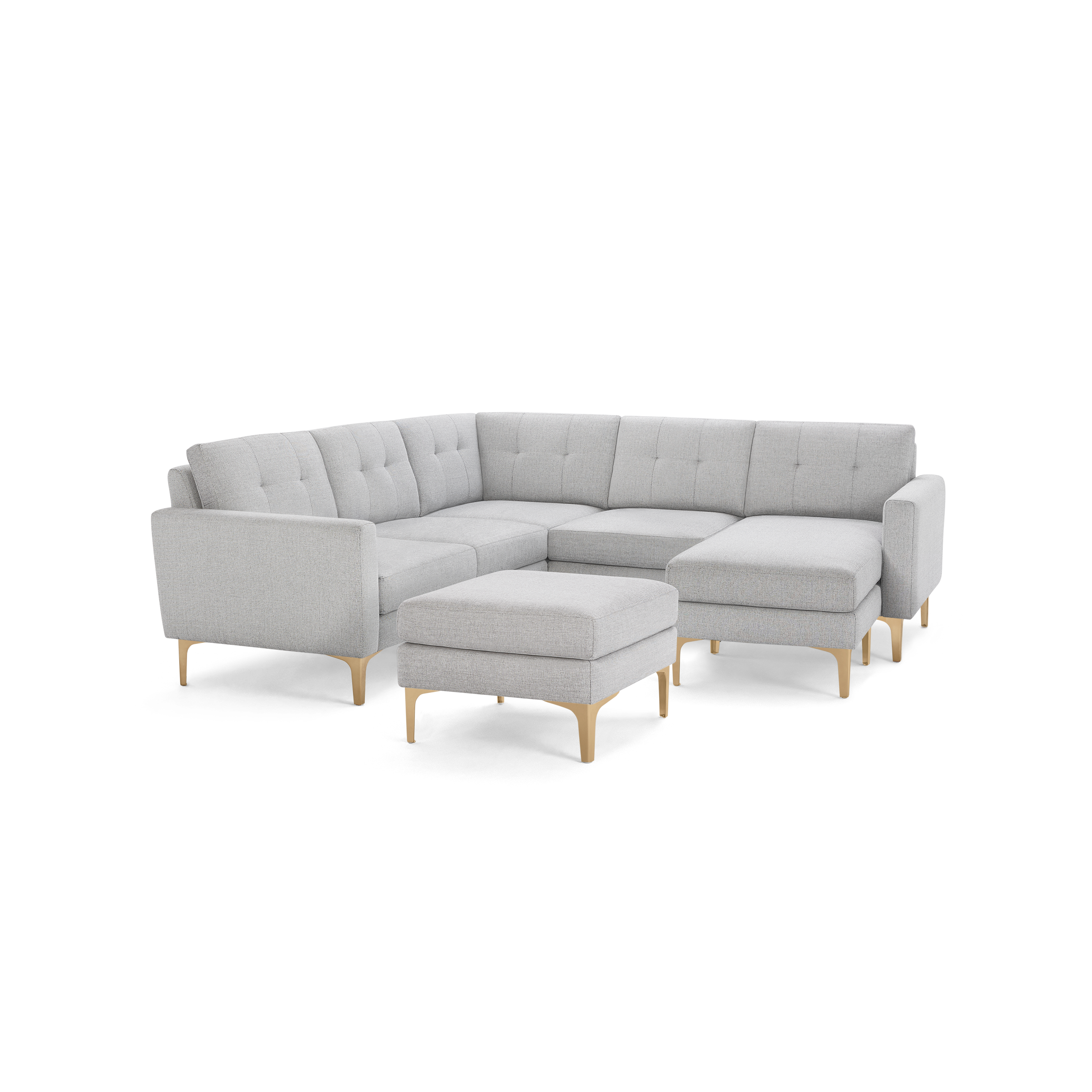 Light gray fabric sectional sofa with tufted back cushions, wooden legs, and a matching ottoman on a black background.