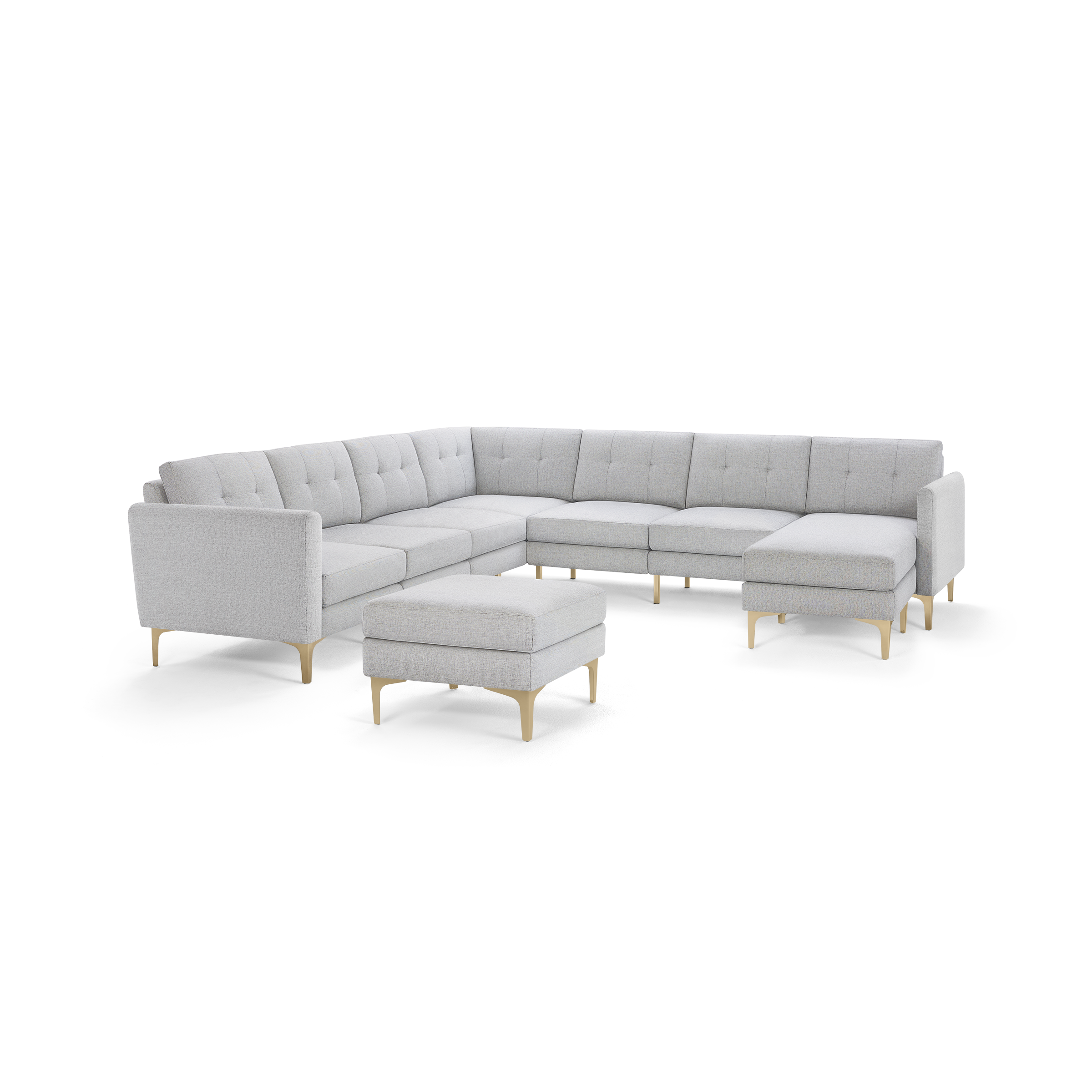 Light gray L-shaped sectional sofa with tufted cushions, wooden legs, and a matching square ottoman, modern style.