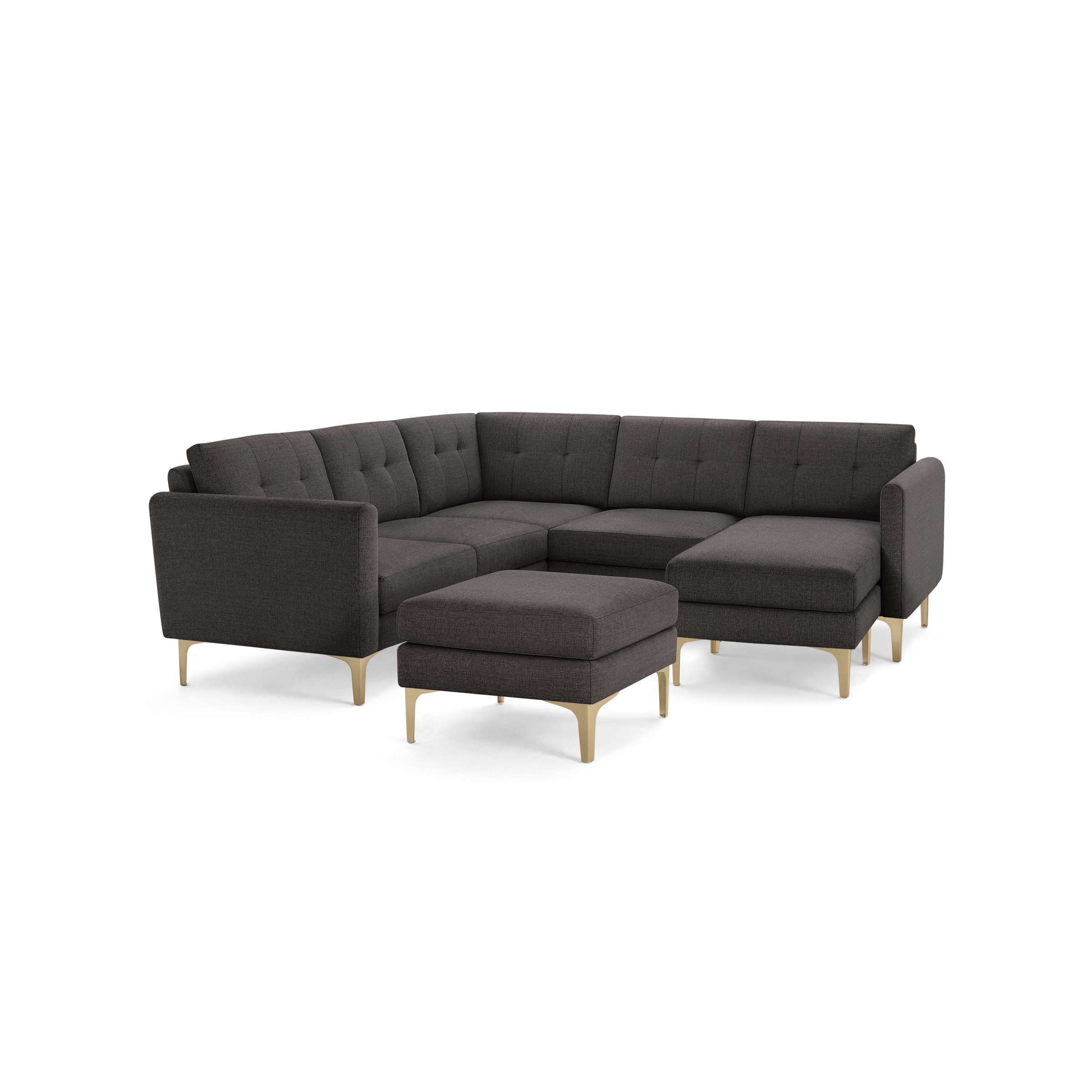 Dark gray tufted fabric sectional sofa with light wooden legs, including a matching ottoman.