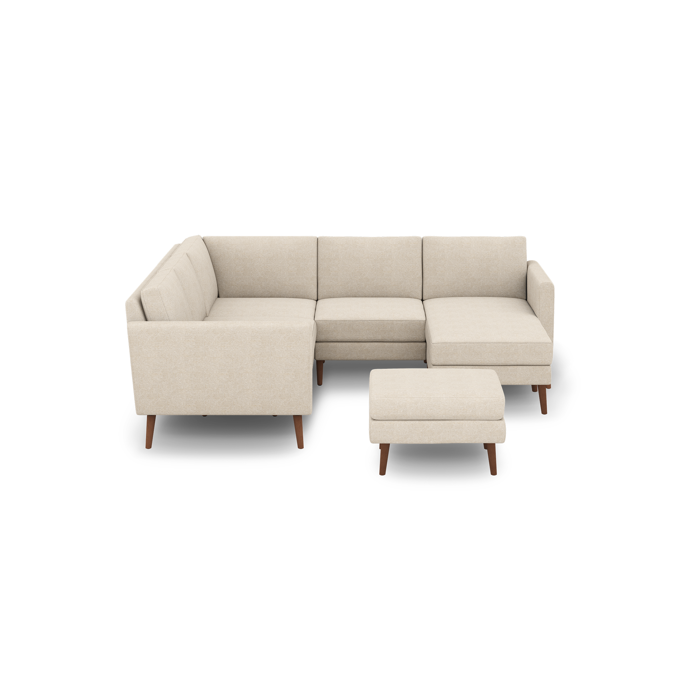 Cream beige L-shaped sectional sofa with wooden legs and matching ottoman, mid-century modern design, soft fabric upholstery.