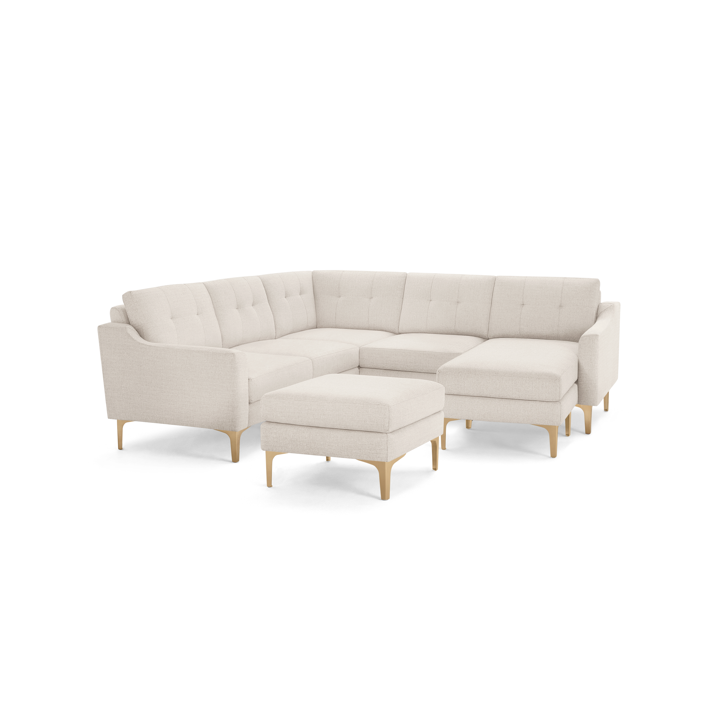 Beige sectional sofa with tufted back cushions, wooden legs, and a matching ottoman, featuring a modern and clean design.