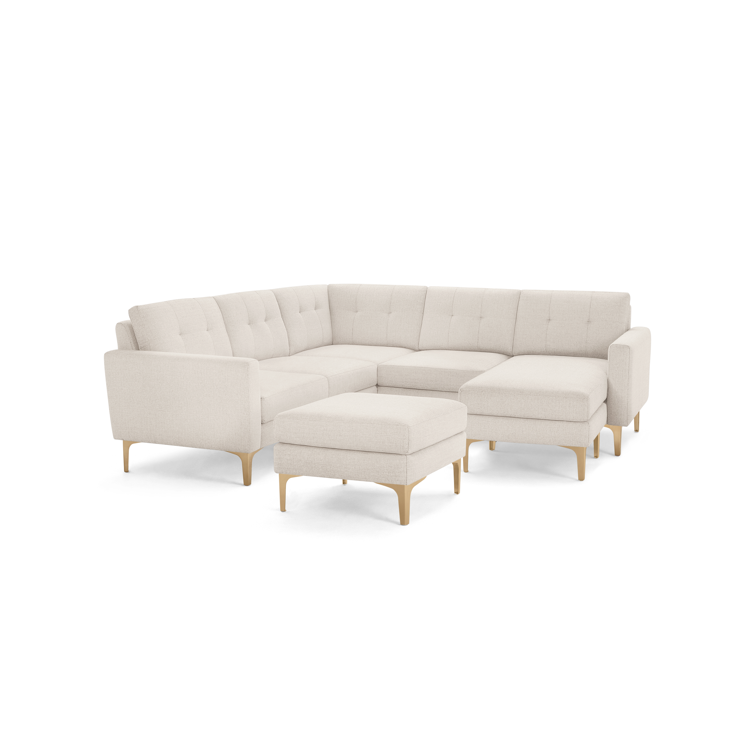 Cream-colored modern sectional sofa with tufted cushions, wooden legs, and matching ottoman on a black background.