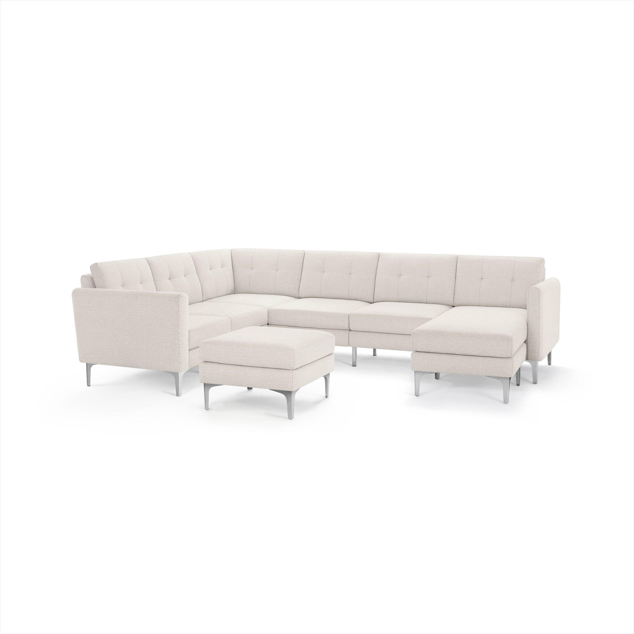 Modern L-shaped beige fabric sectional sofa with tufted cushions, metal legs, and matching square ottoman on white background.