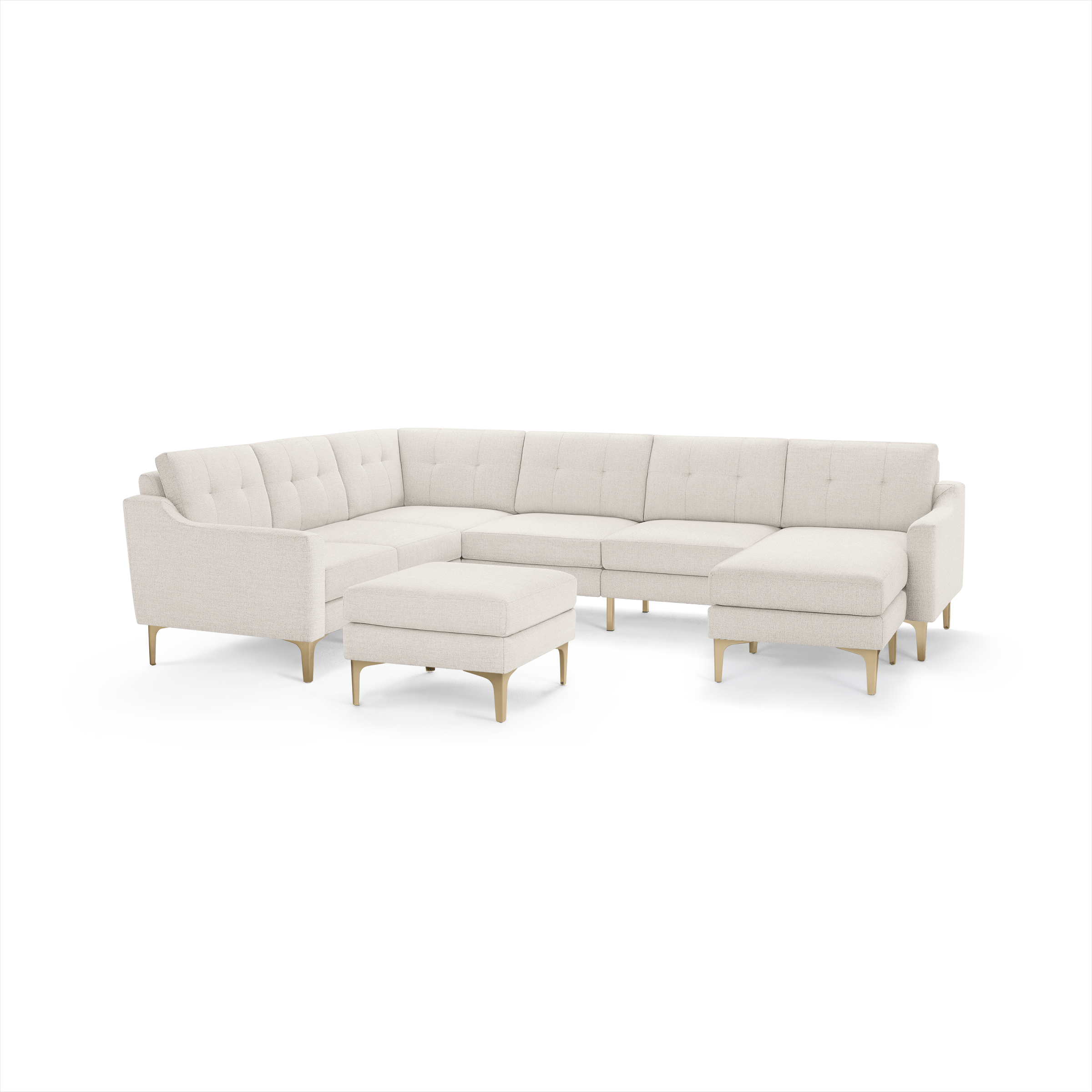 Cream-colored modern sectional sofa with tufted cushions, wooden legs, and matching ottoman on a white background.