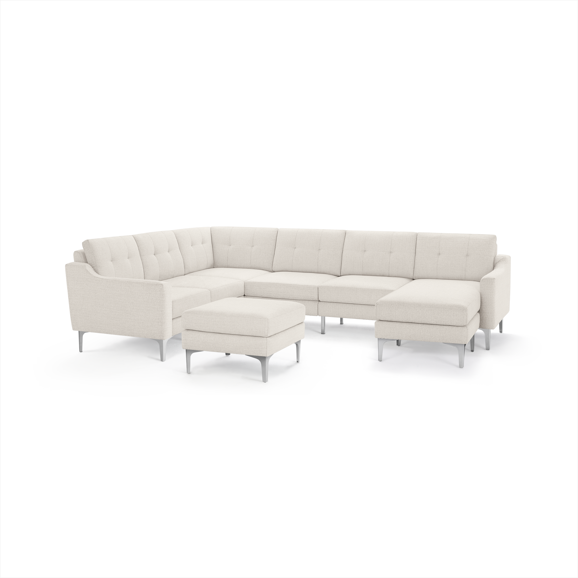 Modern cream-colored sectional sofa with tufted back cushions, metal legs, L-shape design, and matching ottoman.