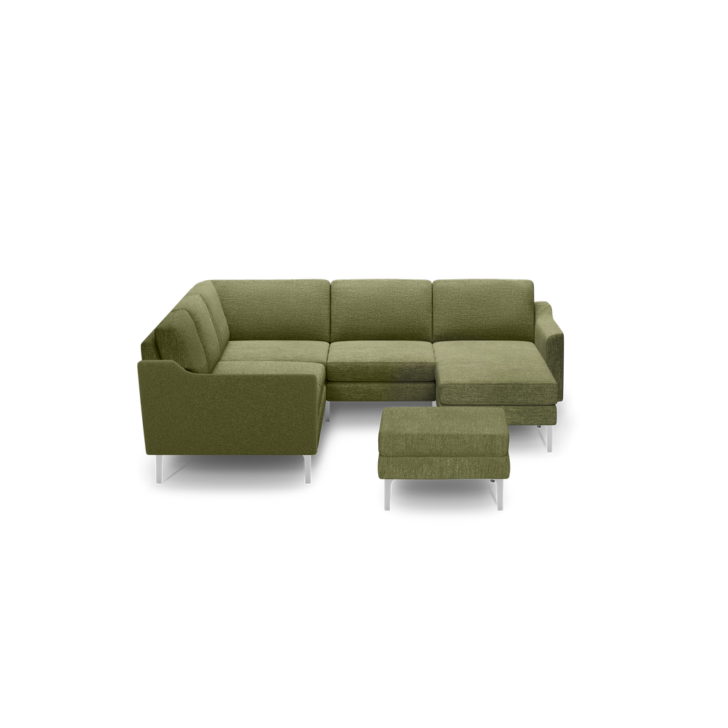 Green fabric L-shaped sectional sofa with matching ottoman and chrome legs, featuring modern clean lines and cushioned seating.