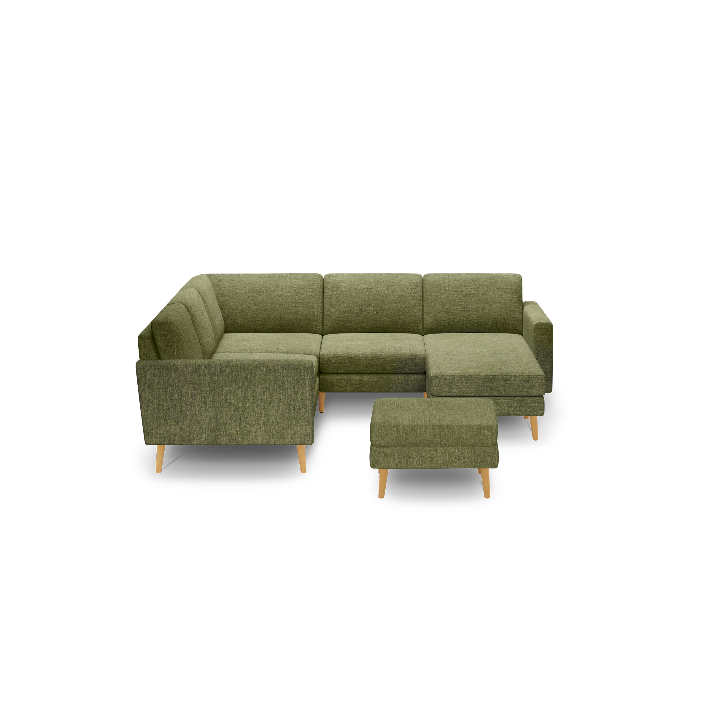 Green upholstered L-shaped sectional sofa with tufted cushions and matching ottoman, featuring light wooden legs against a black background.