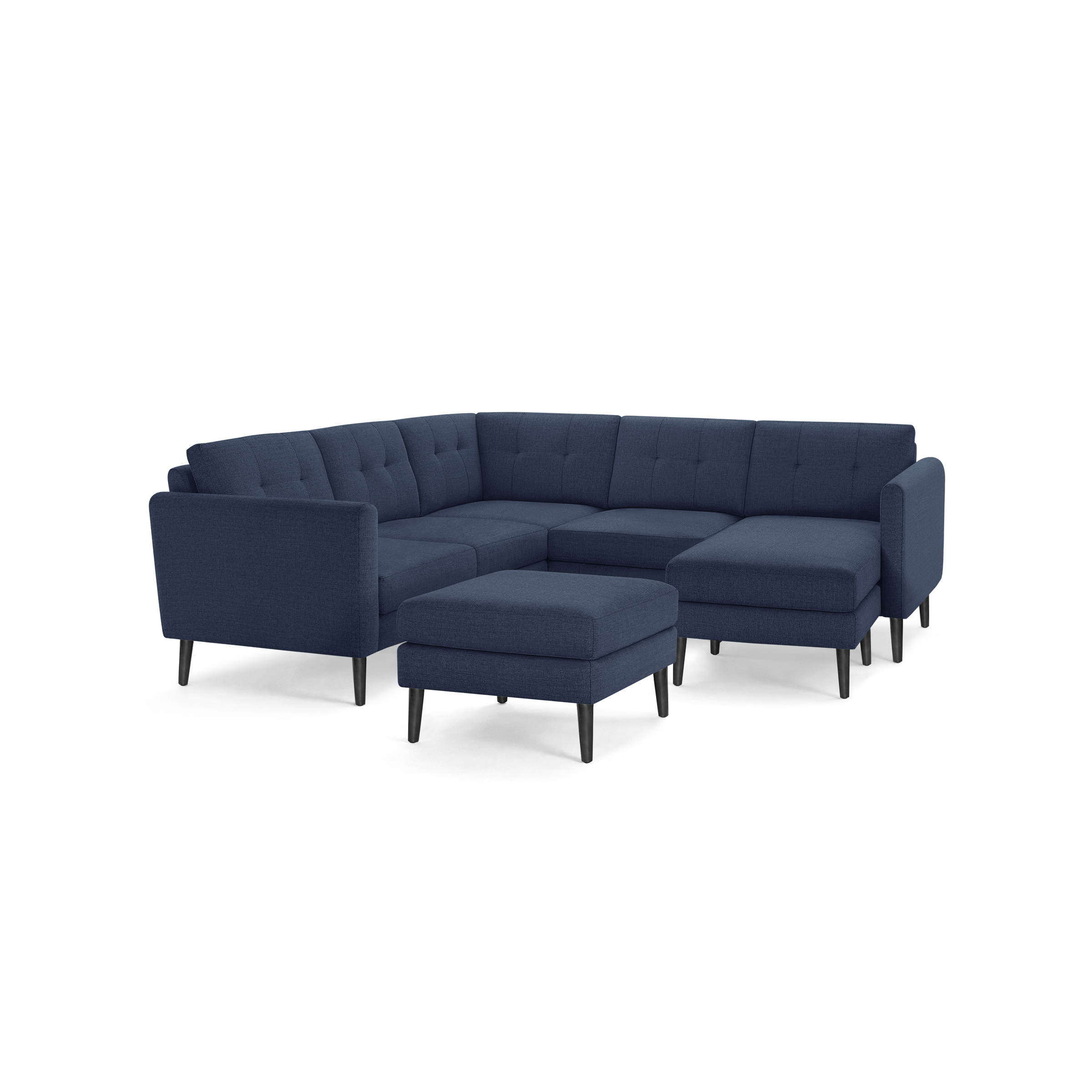 Modern navy blue sectional sofa with tufted cushions and matching ottoman, supported by slender black legs.