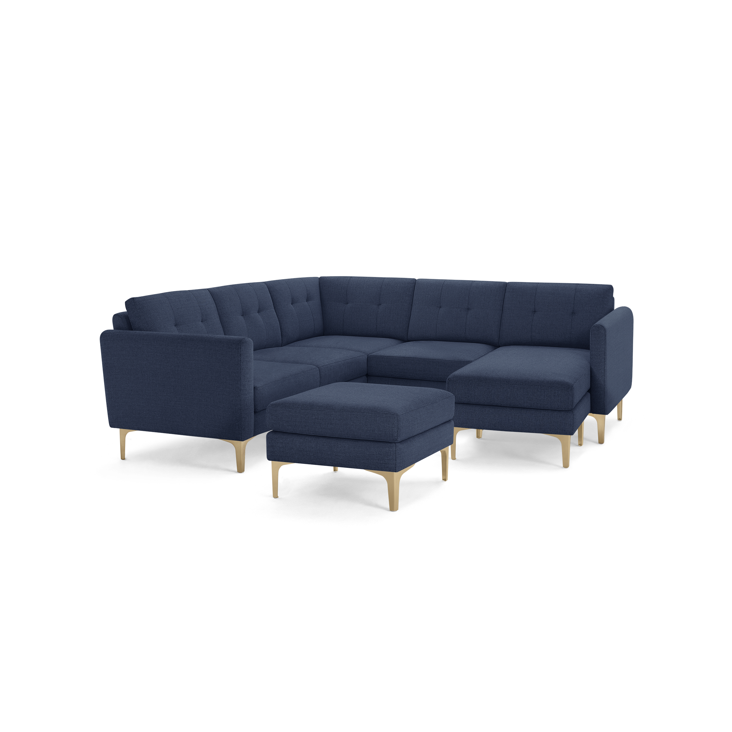 Modern navy blue fabric sectional sofa with tufted cushions and light wooden legs, including a matching ottoman.