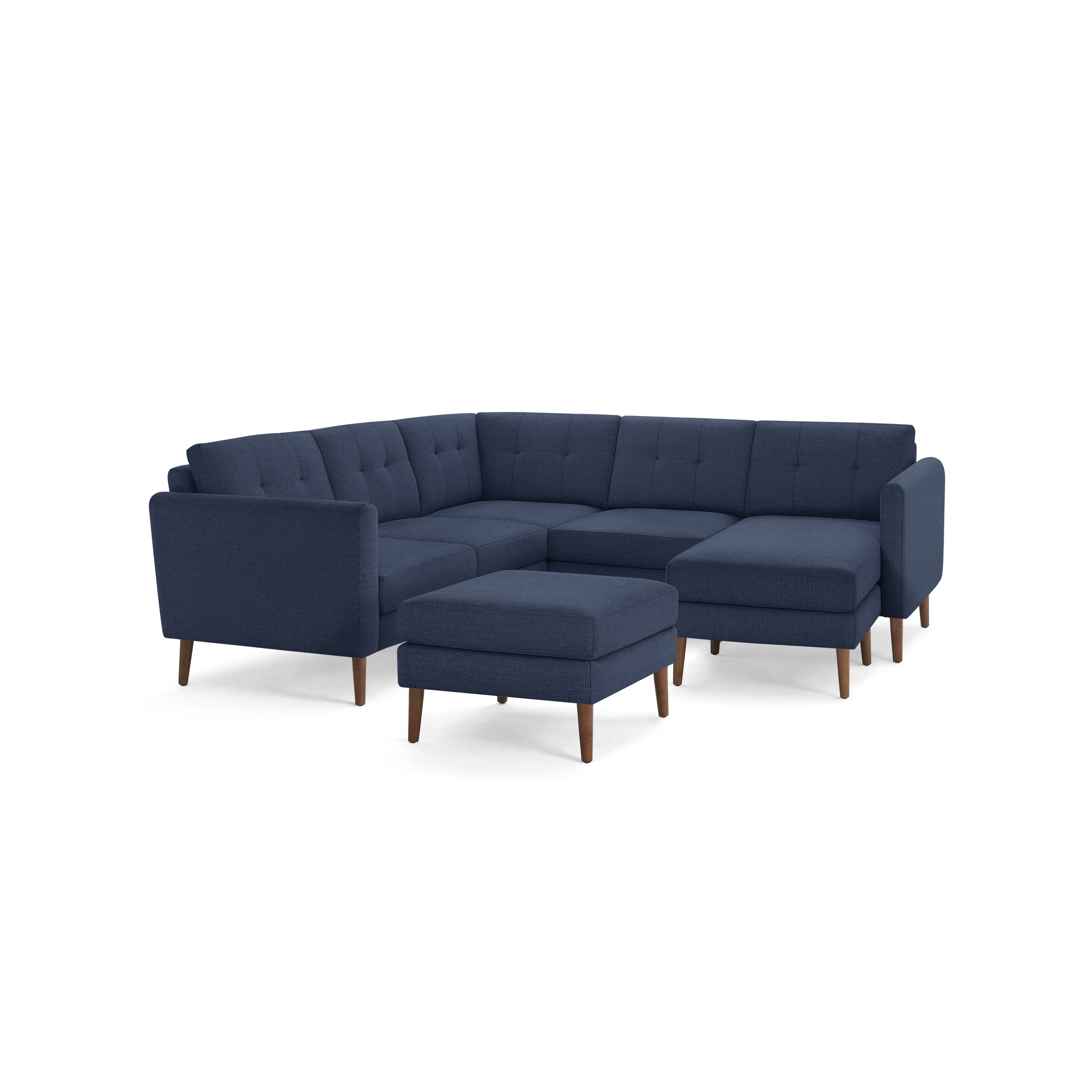 Modern navy blue fabric sectional sofa with tufted cushions, wooden legs, and matching square ottoman for versatile seating.
