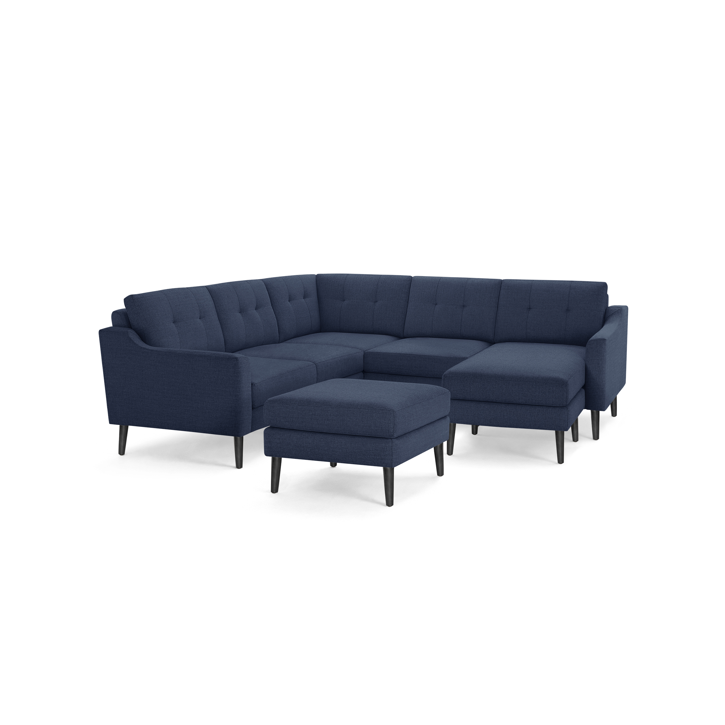 Modern navy blue fabric sectional sofa with tufted back cushions, angled armrests, and matching ottoman on black tapered legs.